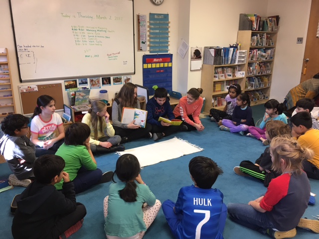 Enjoying reading to younger friends en espanol.