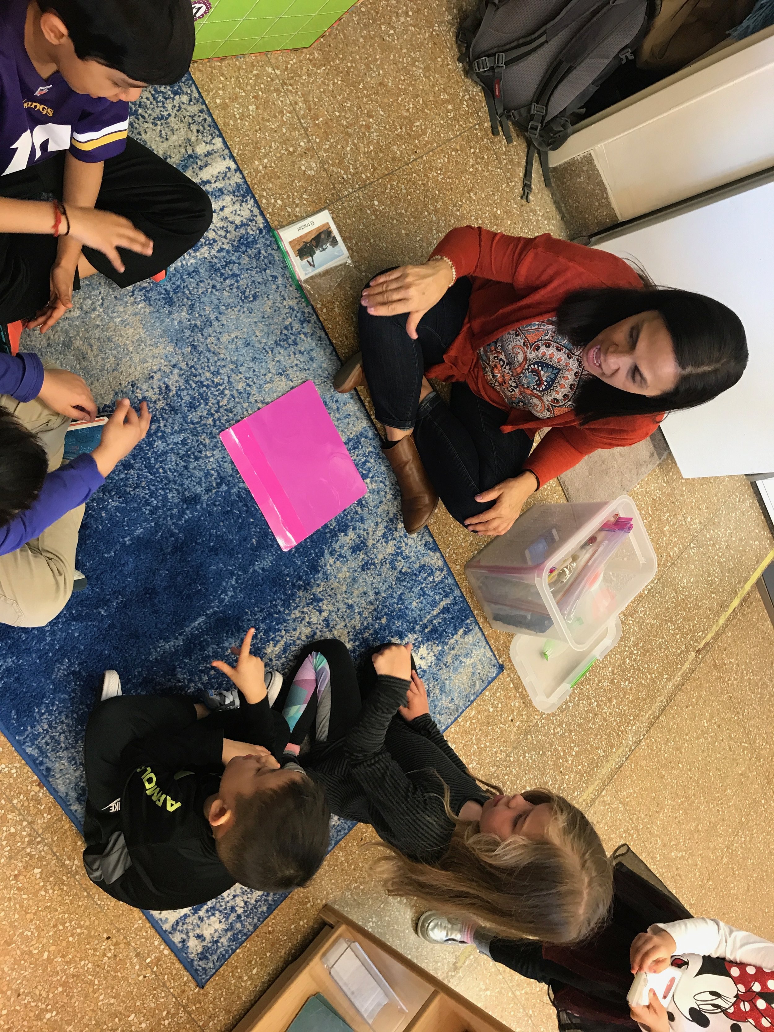 Ks enjoying some singing in Spanish with Ms. Solange!