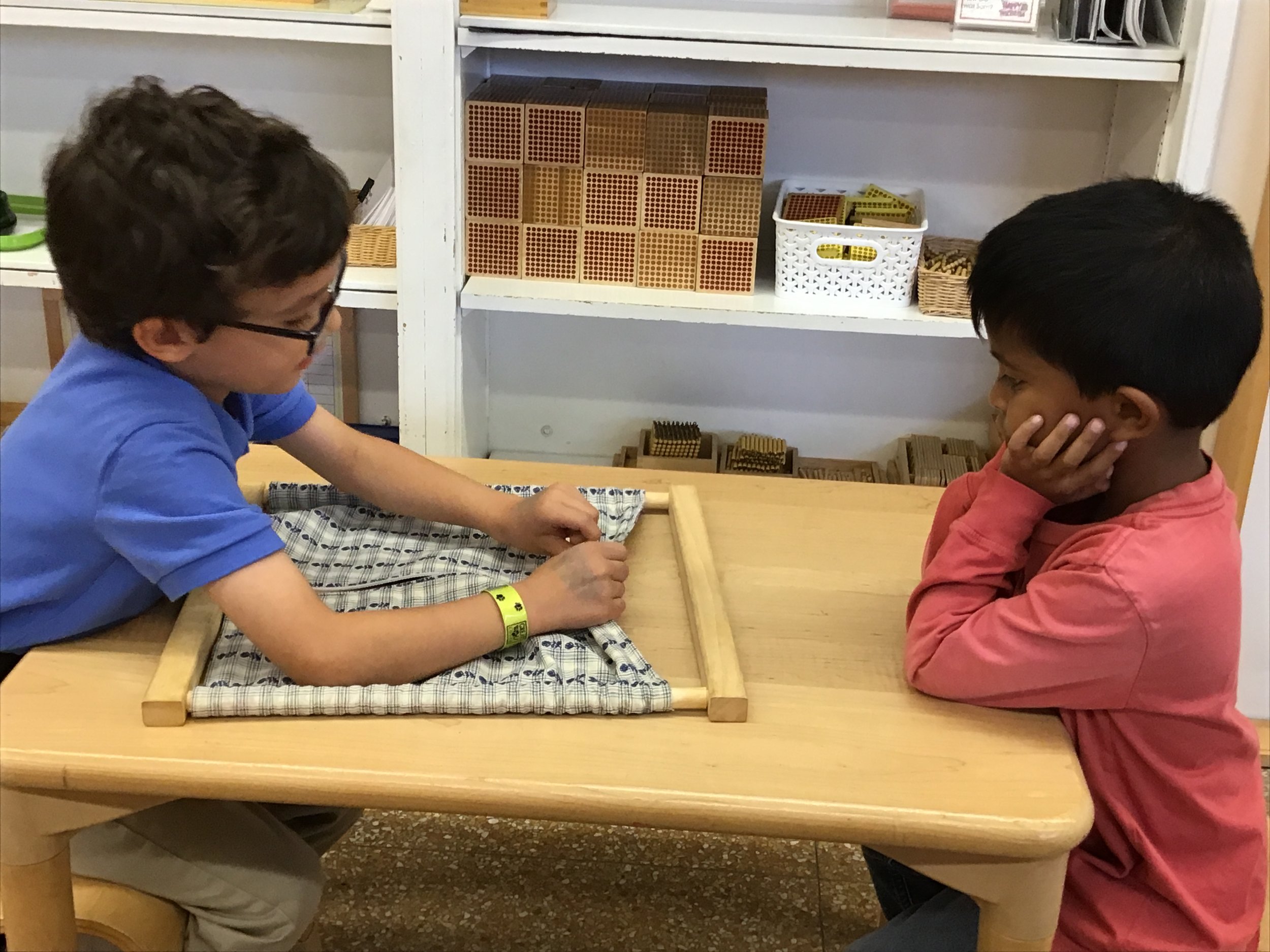 Demonstrating the zipper frame for a younger friend.