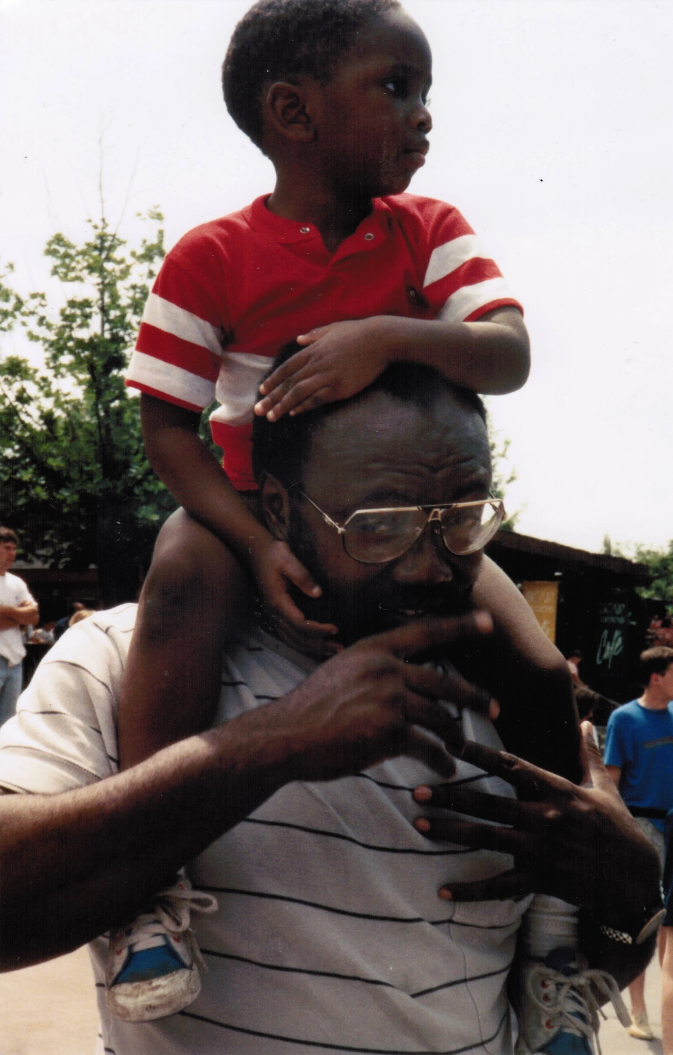 Okechi with Nnadozie on his shoulders.jpg