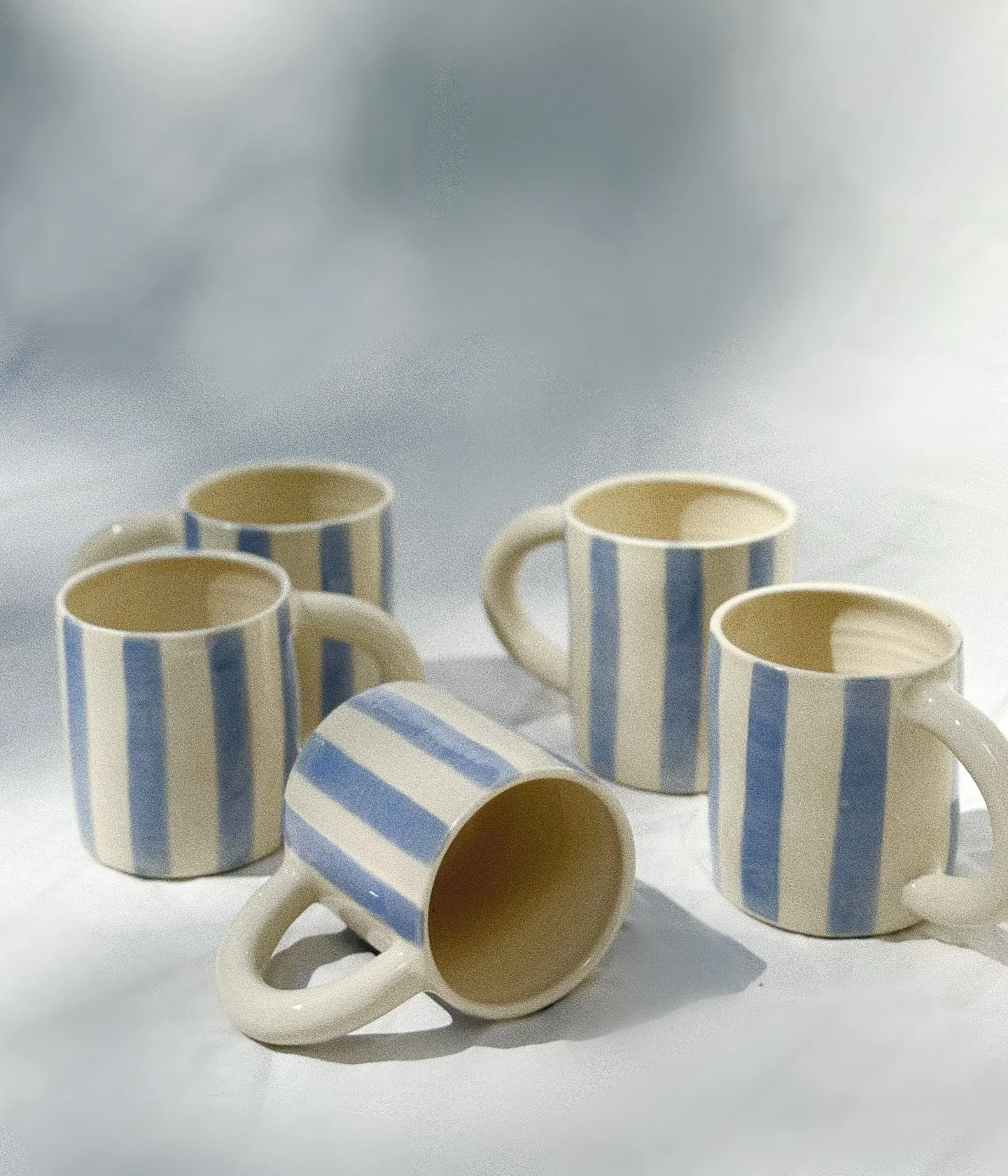 Tall Stripe Mug in French Blue coming TOMORROW for the September Collection release @ 2 pm EST πππ 
π·οΈ Pottery handmade ceramics wheelthrown glaze coffee mug cottage core cappuccino cup French blue stripe glossy