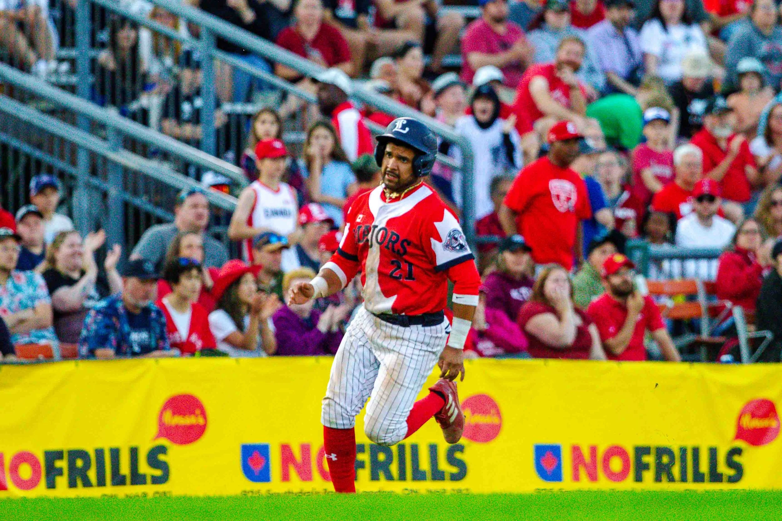   Tommy Reyes-Cruz scores a run in front of a packed crowd of 5,000 at Labatt Park on Canada Day, Monday, July 1, 2024. (Photo: Matt Hiscox Photography).  
