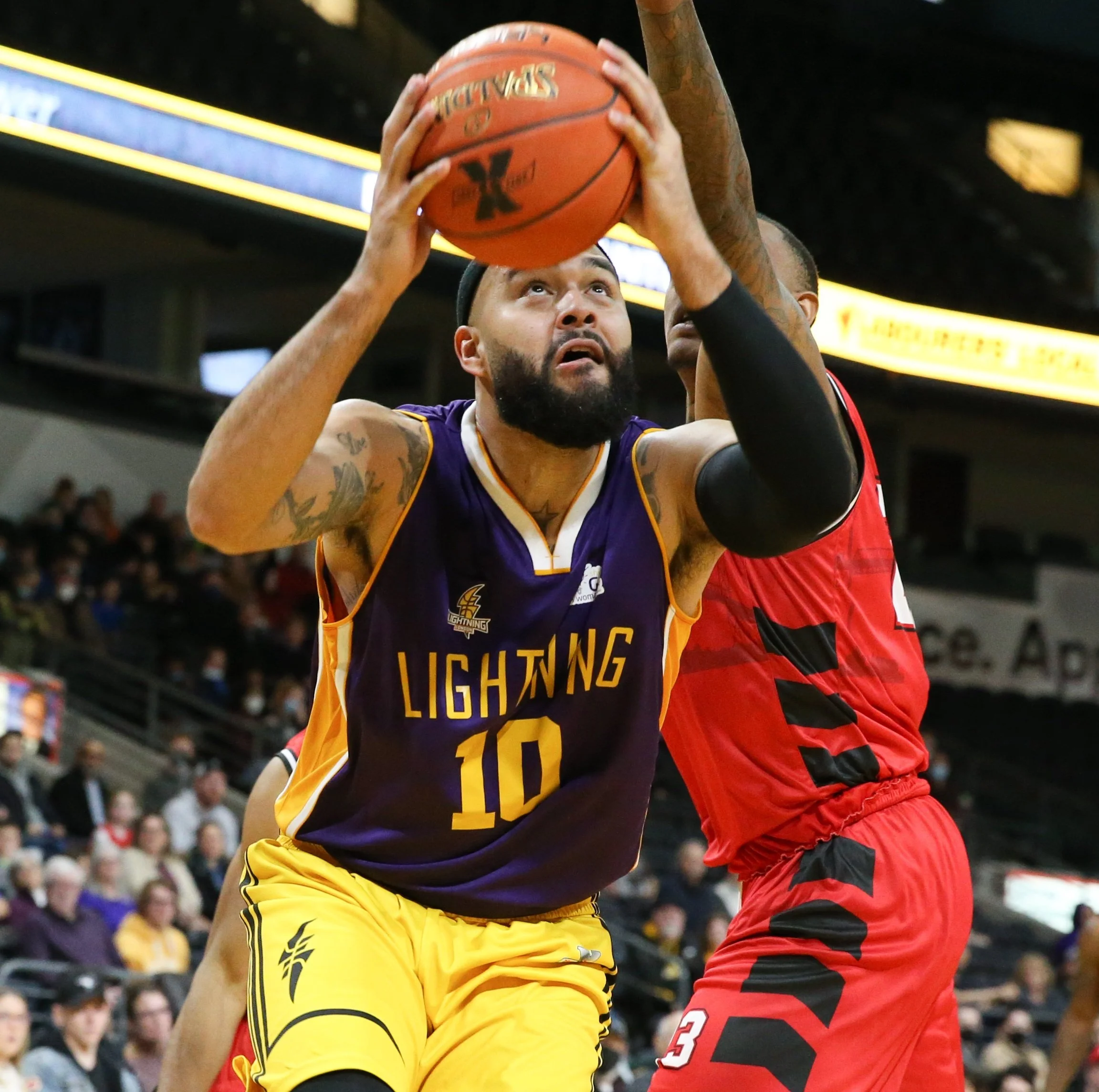   Cameron Forte, shown here sporting the Lightning’s special purple jerseys (worn last Sunday in support of the London Abused Women’s Centre), continues to lead the Lightning in scoring. He’s averaging a double-double (22.6 points/11.3 rebounds) through the team’s first 11 games.  (Photo: Luke Durda).  