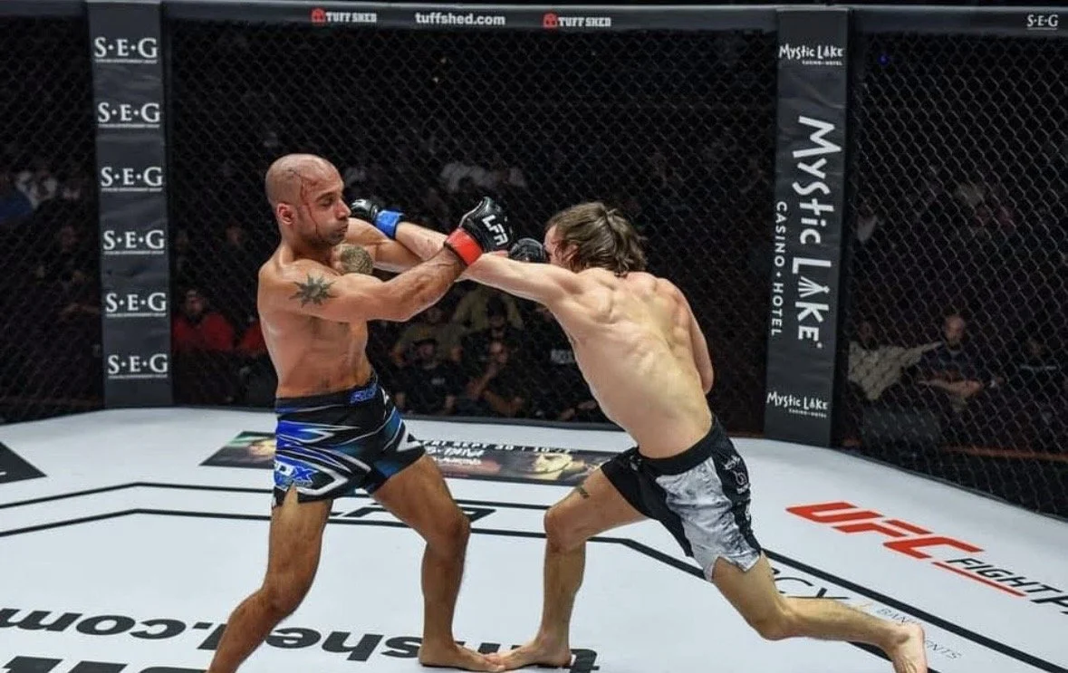 Two mixed martial arts fighters in a cage, MMA Leading edge MMA