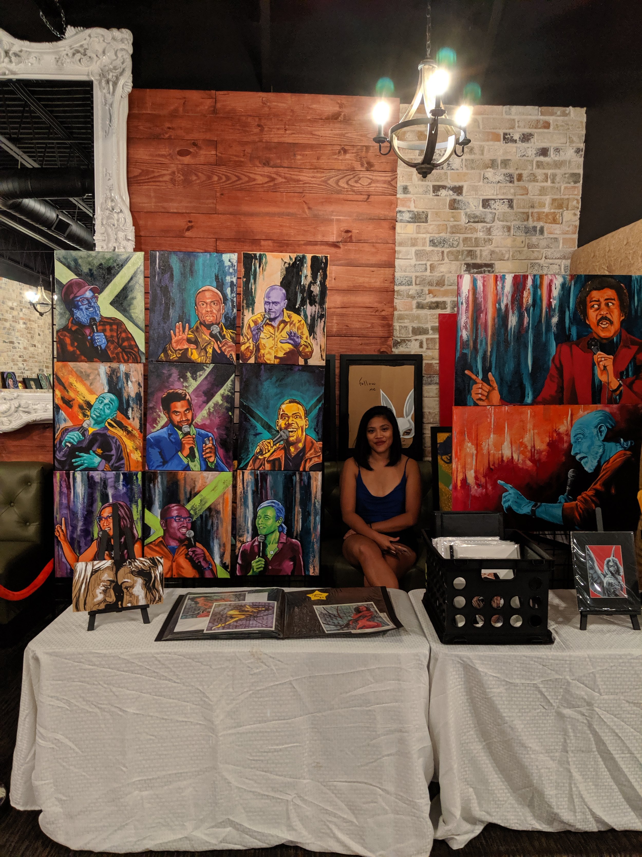 My beautiful wife watching my booth at the art show with NightJunkie