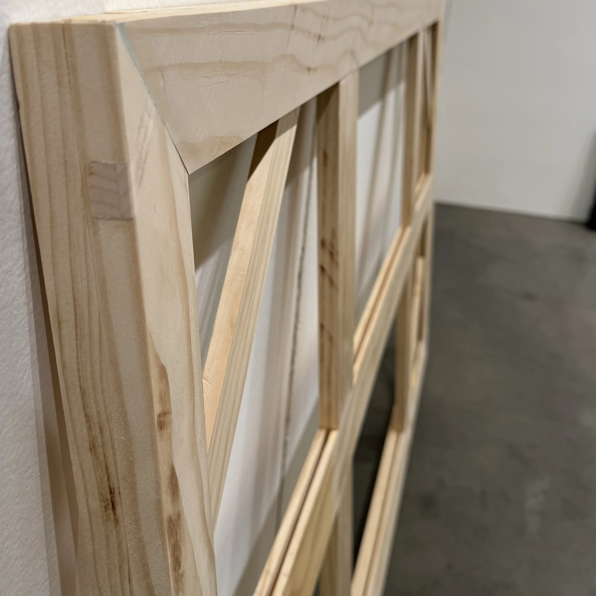 Made from Pine, with beveled edge to hide frame behind the artwork