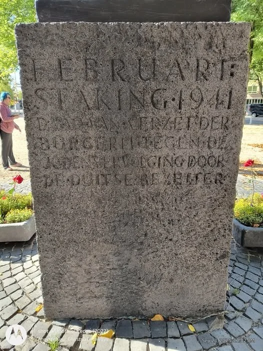 A stone memorial with an inscription commemorates those who served in February 1941, mentioning the bravery of a soldier and urging to keep the door of duty open.