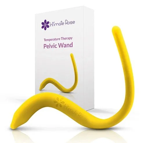 Yellow pelvic wand used for temperature therapy in front of the product's packaging box labeled 'Intimate Rose' and 'Pelvic Wand'.