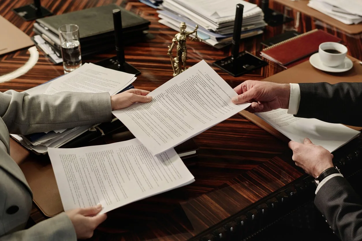 Lawyer and client reviewing documents for a parole board hearing