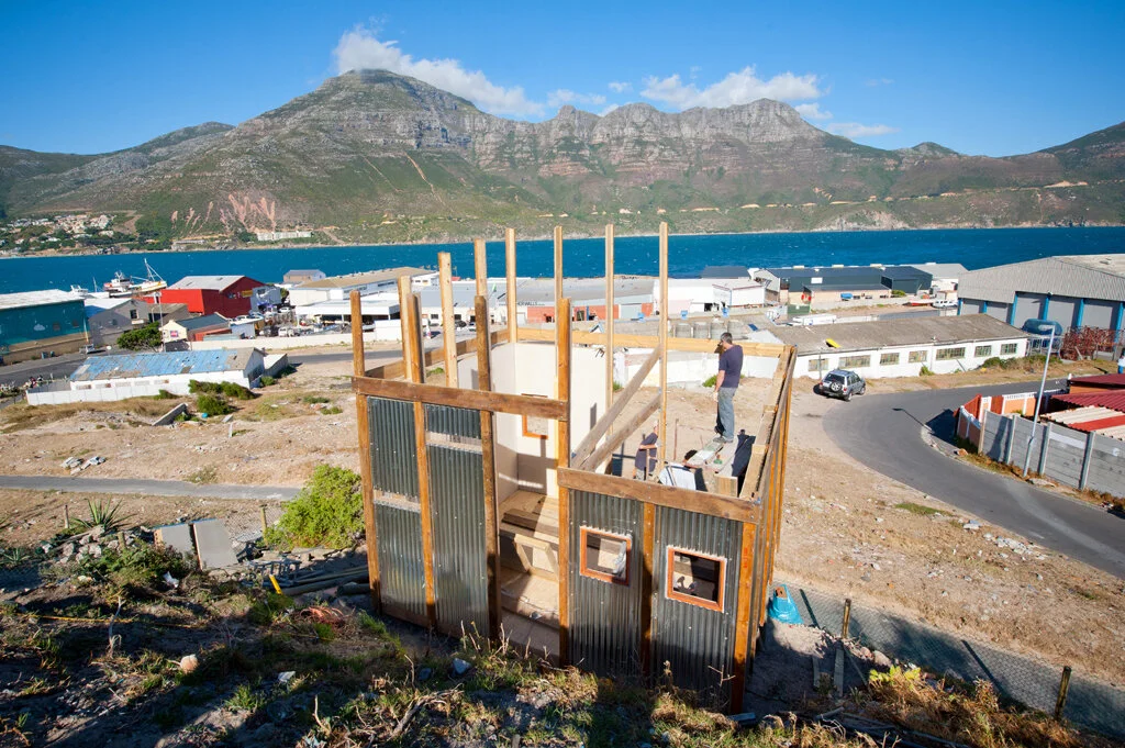 Xoma's house under construction, using recycled building material