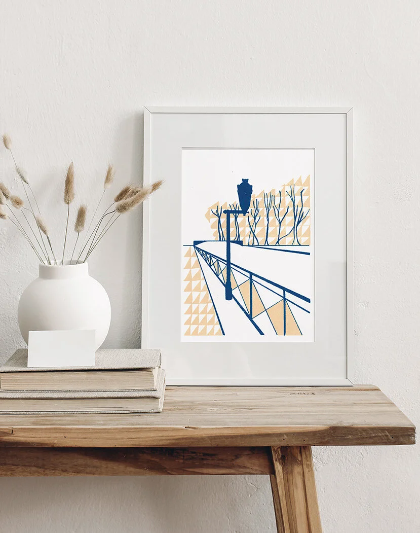 France-inspired canal art sits in a frame