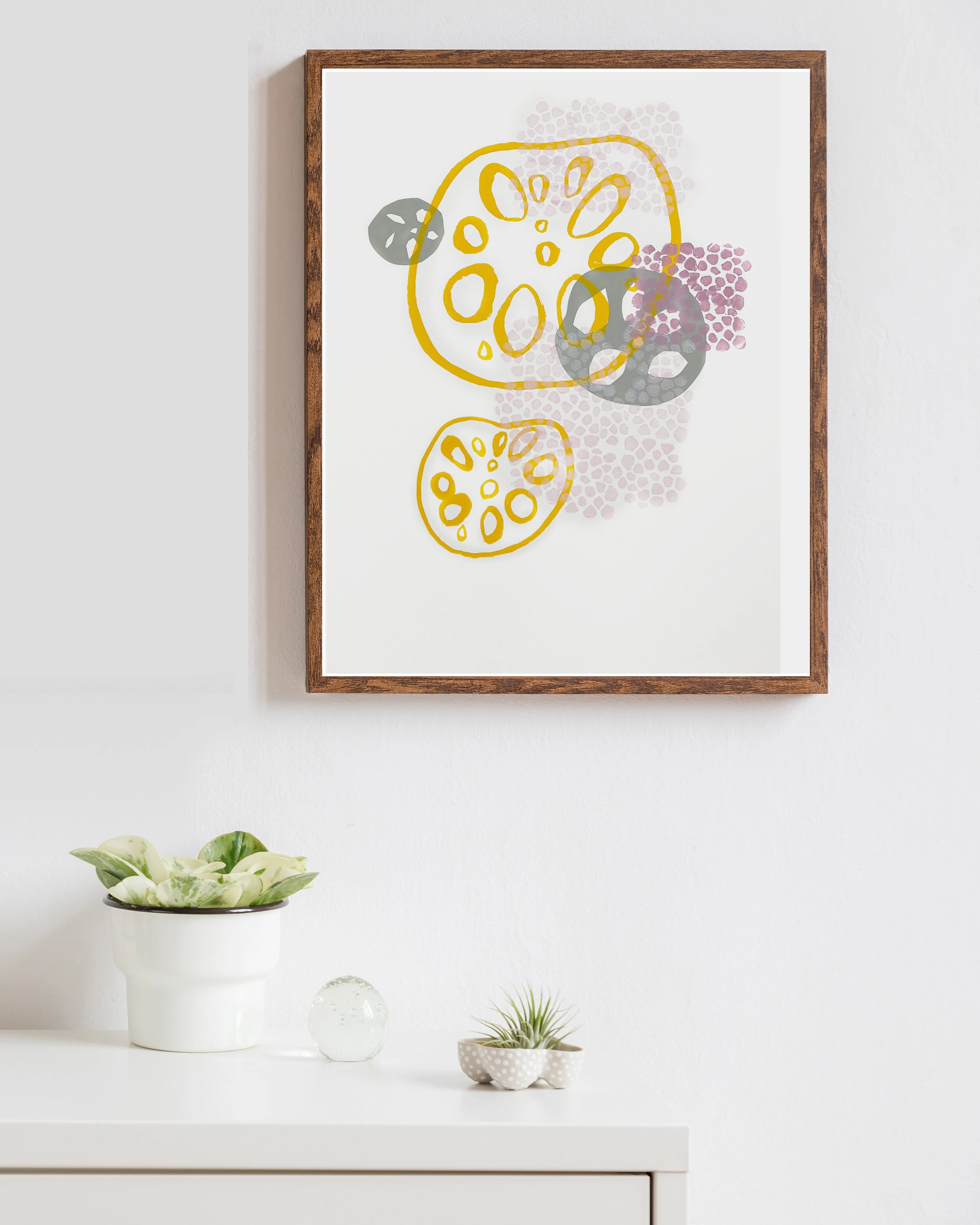 a multi-colored minimalist lotus print, framed