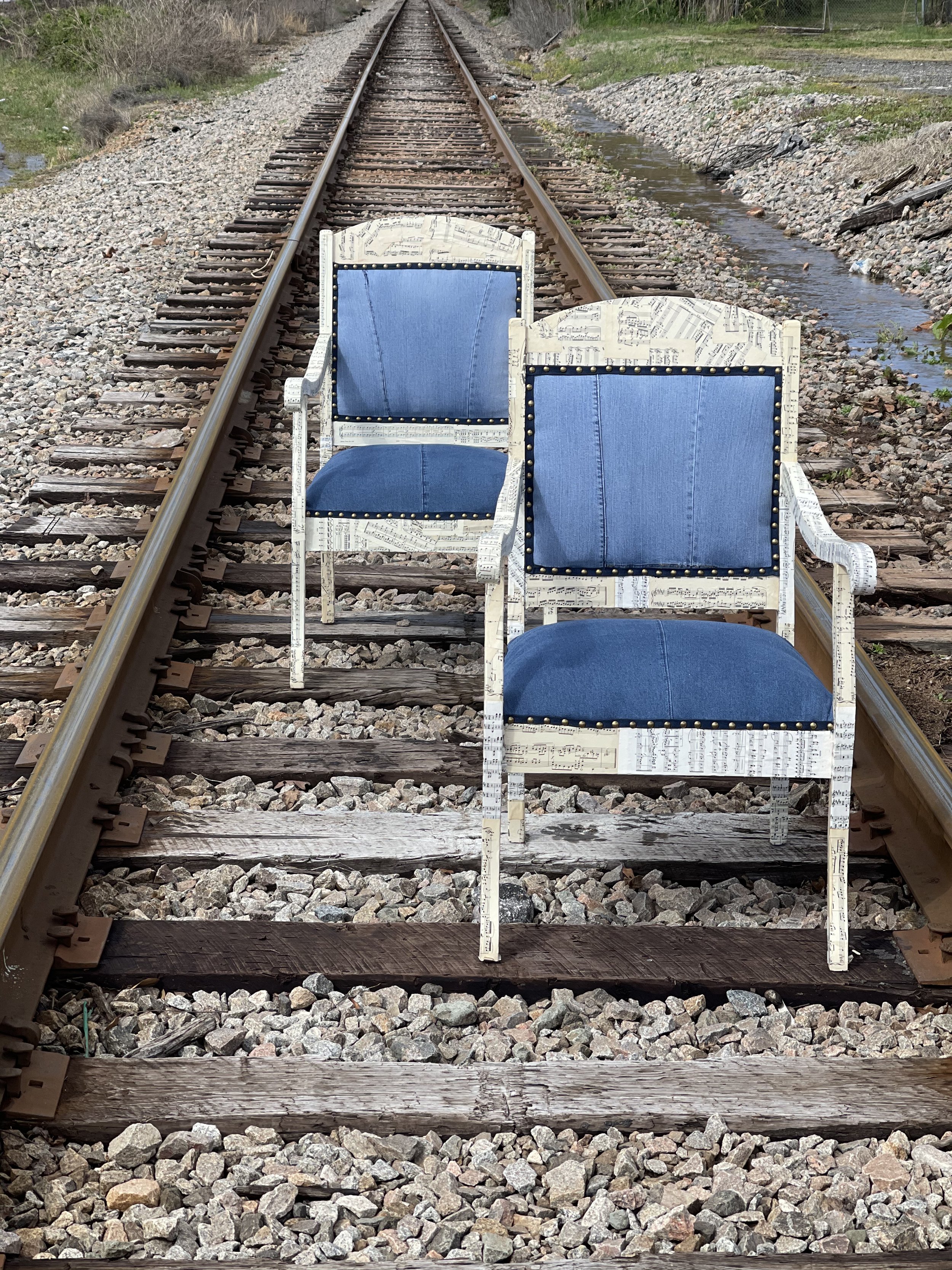 We salvaged these end chairs from a Farm House in SC and covered them in sheet music and salvaged denim. // SOLD