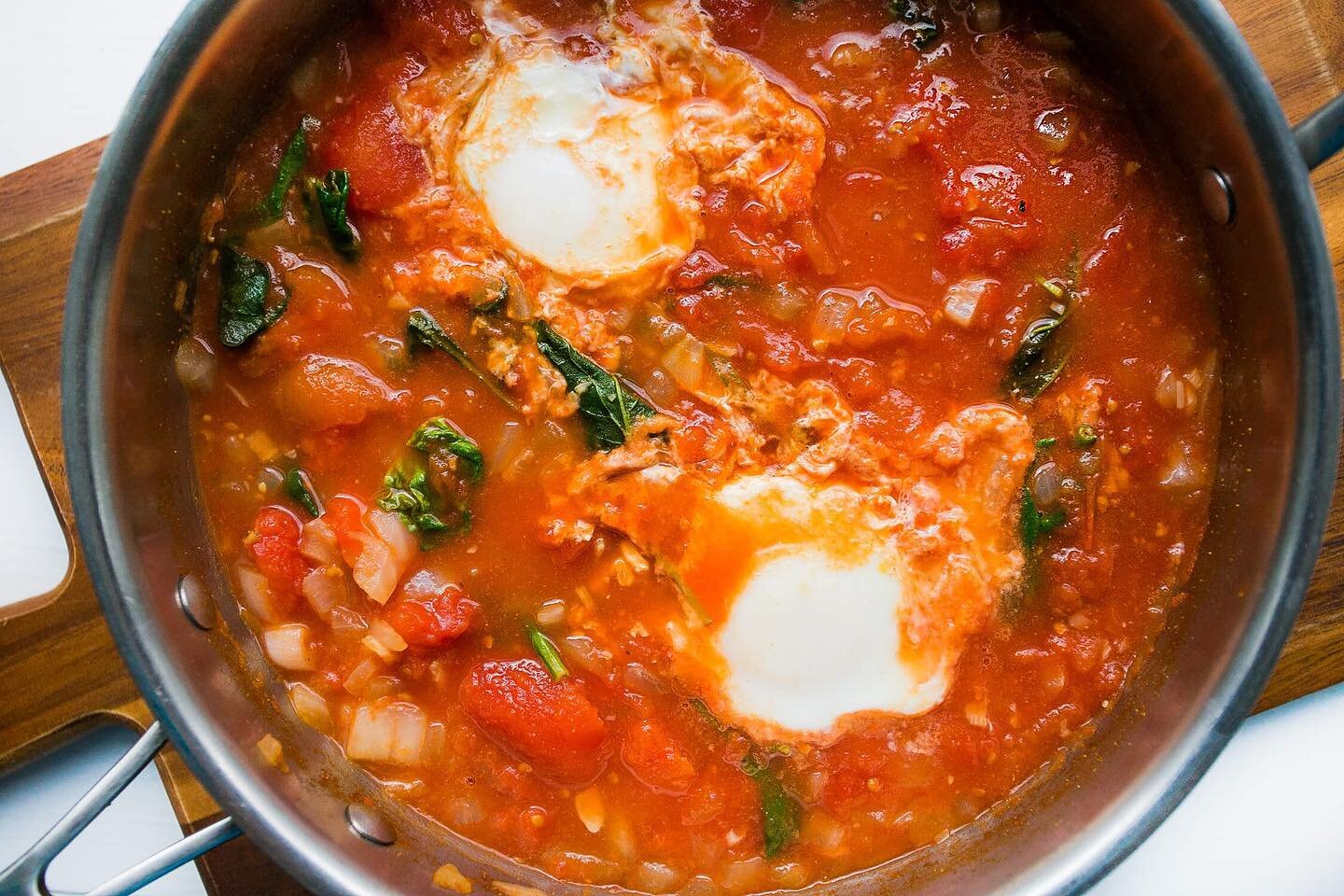 Yummy weekend breakfast/brunch. Tomato Shakshuka. Great served with some sourdough and some greens (rocket, kale...) 
Serves 2 

1 tbsp
Extra Virgin Olive Oil
1 White Onion (chopped)
1 Garlic (clove, minced)
1.5 tsp Cumin
1.5 tsp Paprika
1/2 tsp Sea 