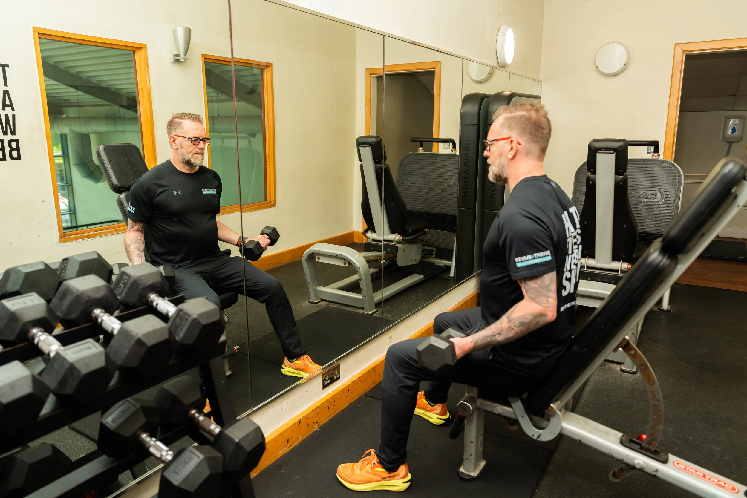 Revive and Thrive Gym picture Seated bicep curl