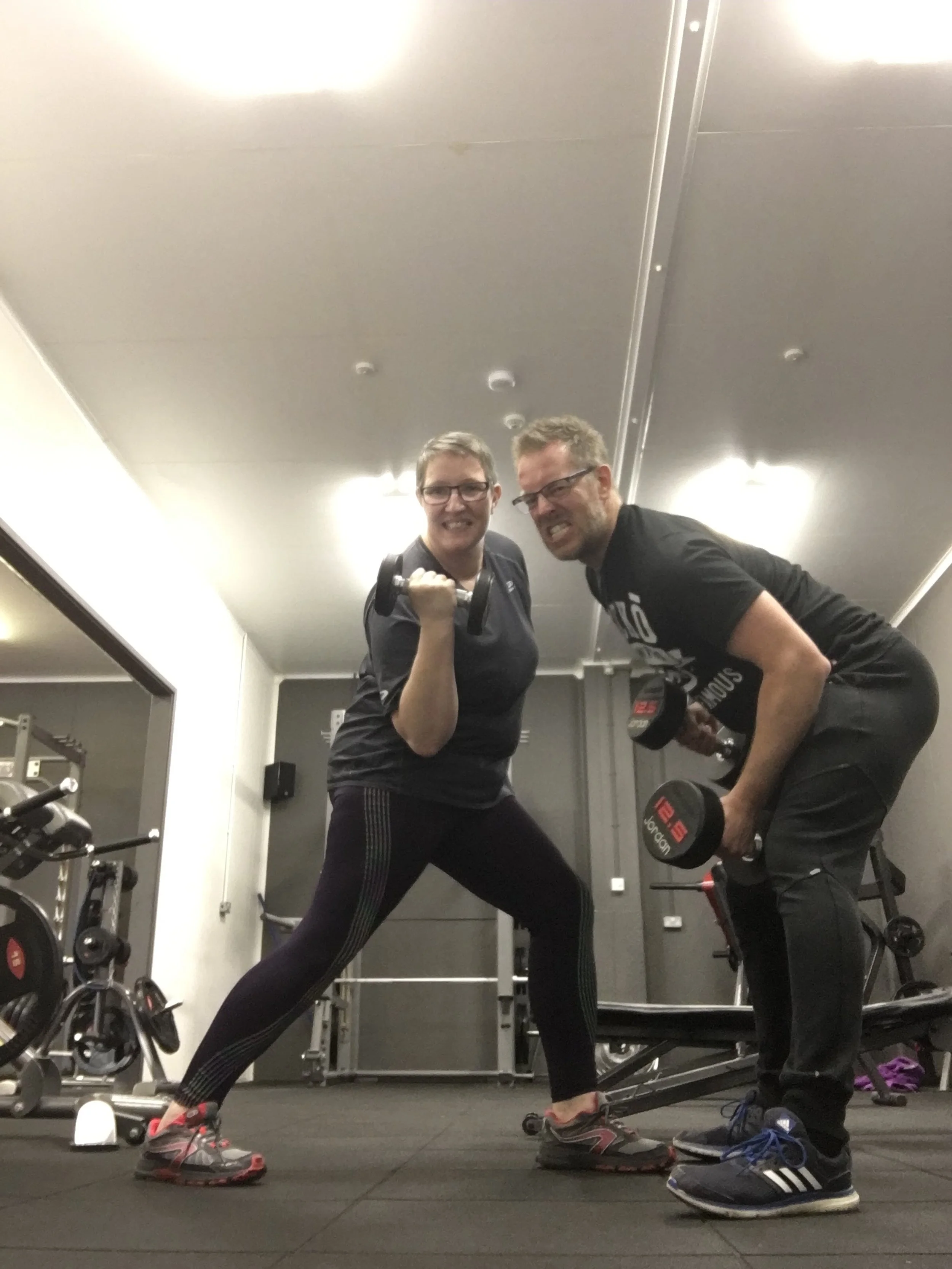 Fitness client working out with dumbbells