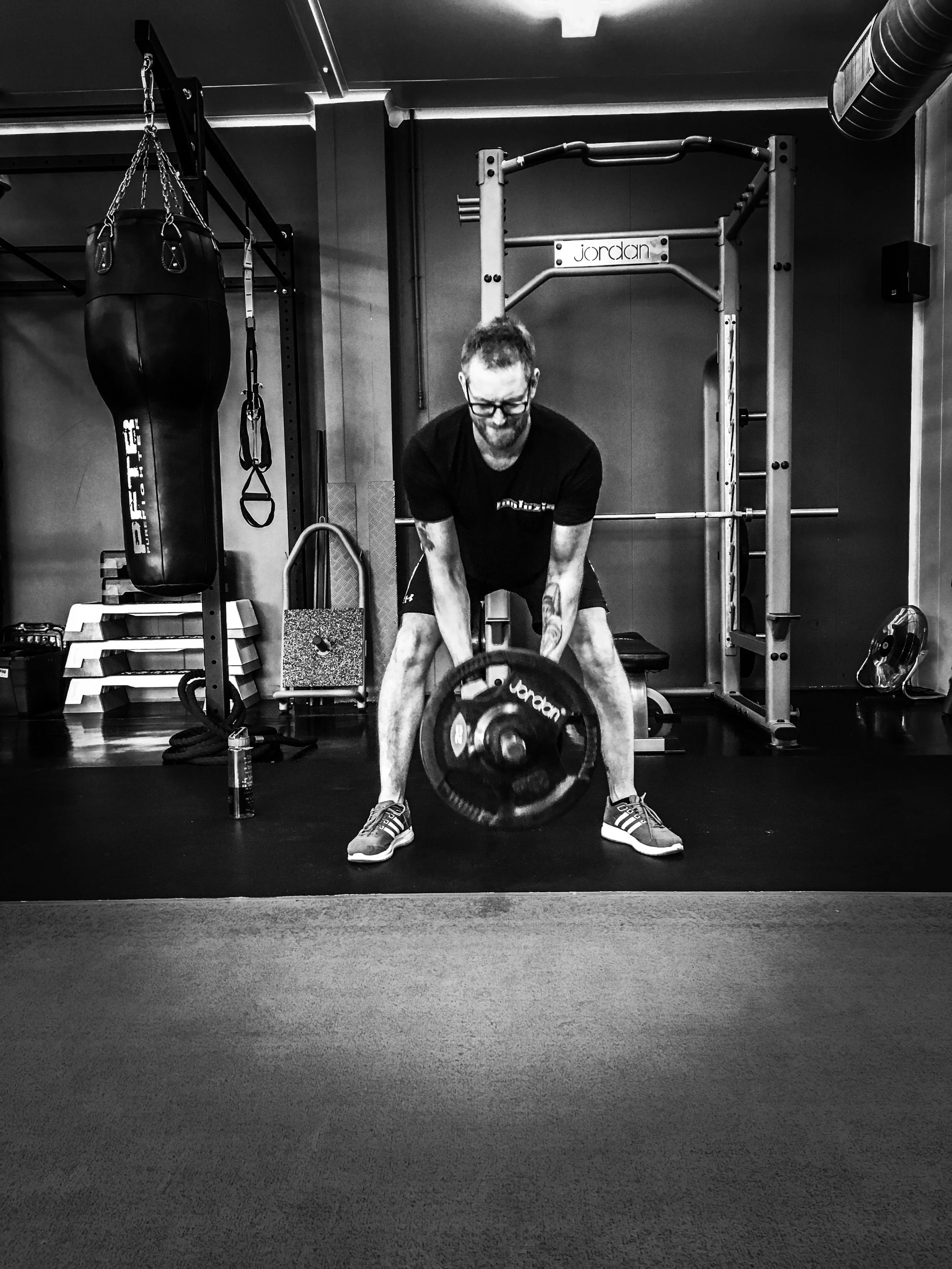 Barbell rows in black and white