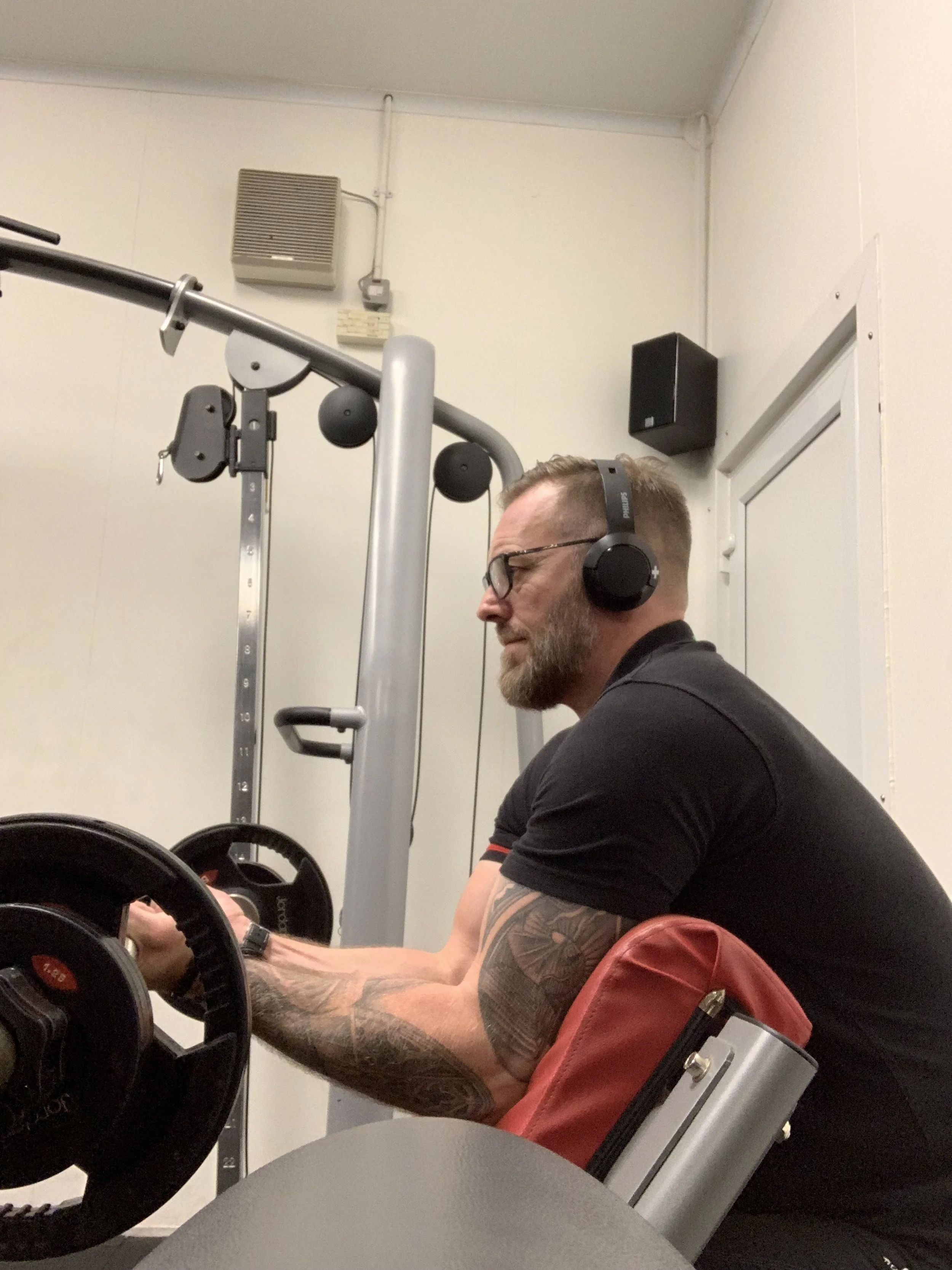 Doing preacher curls with a bar.