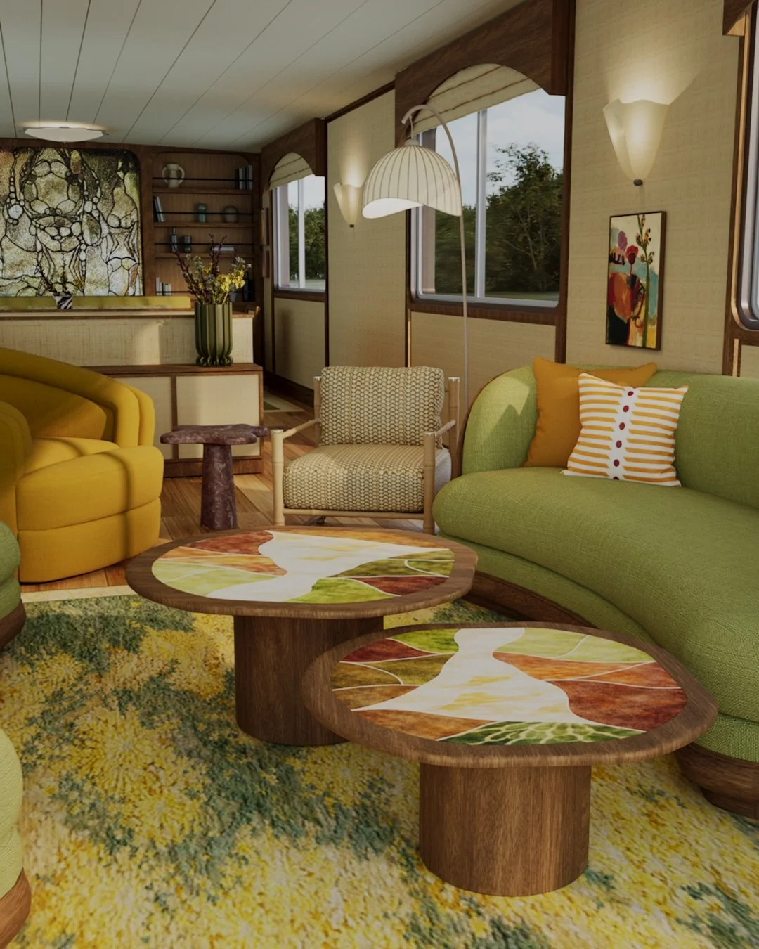 A colorful living room with green and yellow couches, two patterned coffee tables with leaf designs, a patterned rug, a beige armchair, and a large window showing trees outside. The room has wall-mounted lights, a painting, and a vase with flowers.