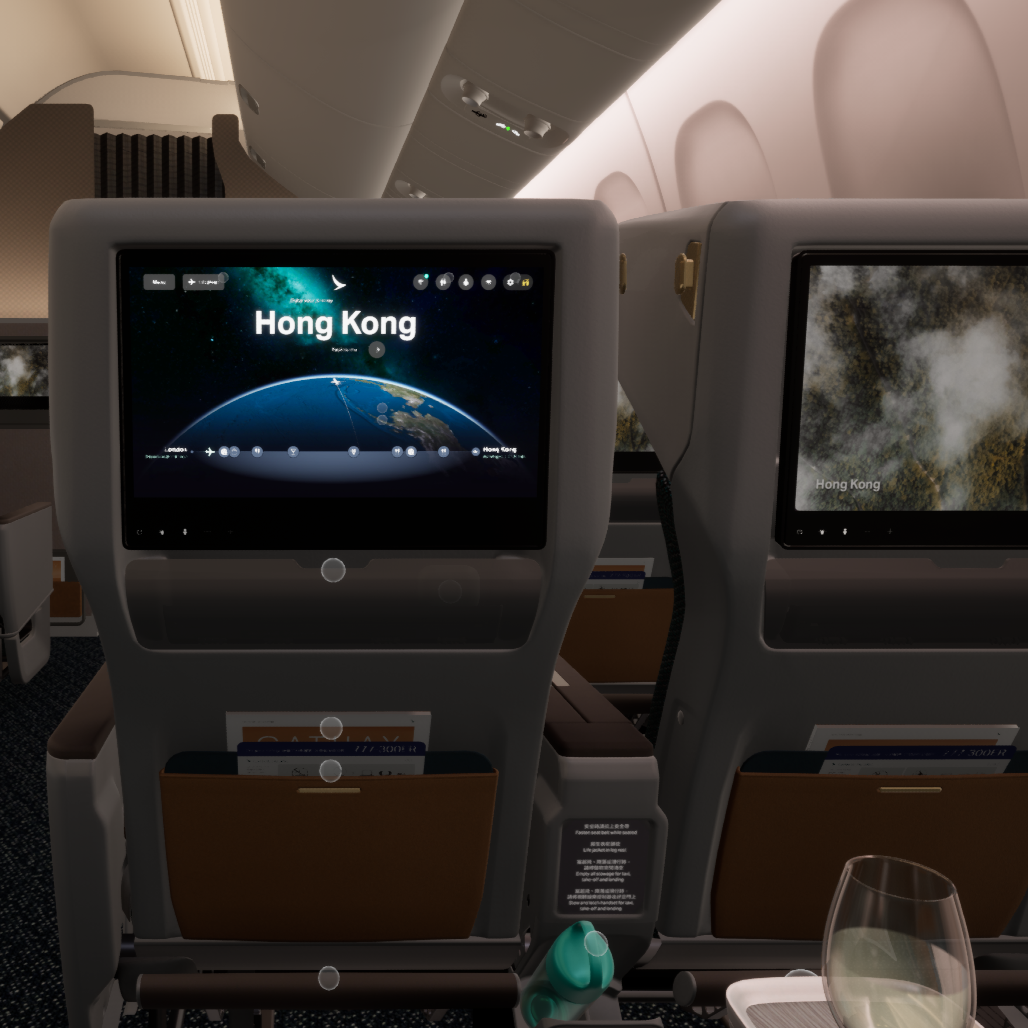 In-flight entertainment screens showing flight to Hong Kong on an airplane.