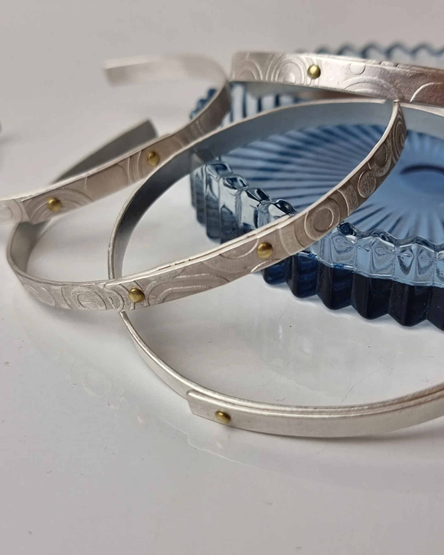 Well, that was an unexpectedly fun afternoon!  I've been musing about a simple riveted bangle for a while - and today I actually got round to putting it into action.  I watched the cloud descend over the hills from my Studio window, and hunkered down