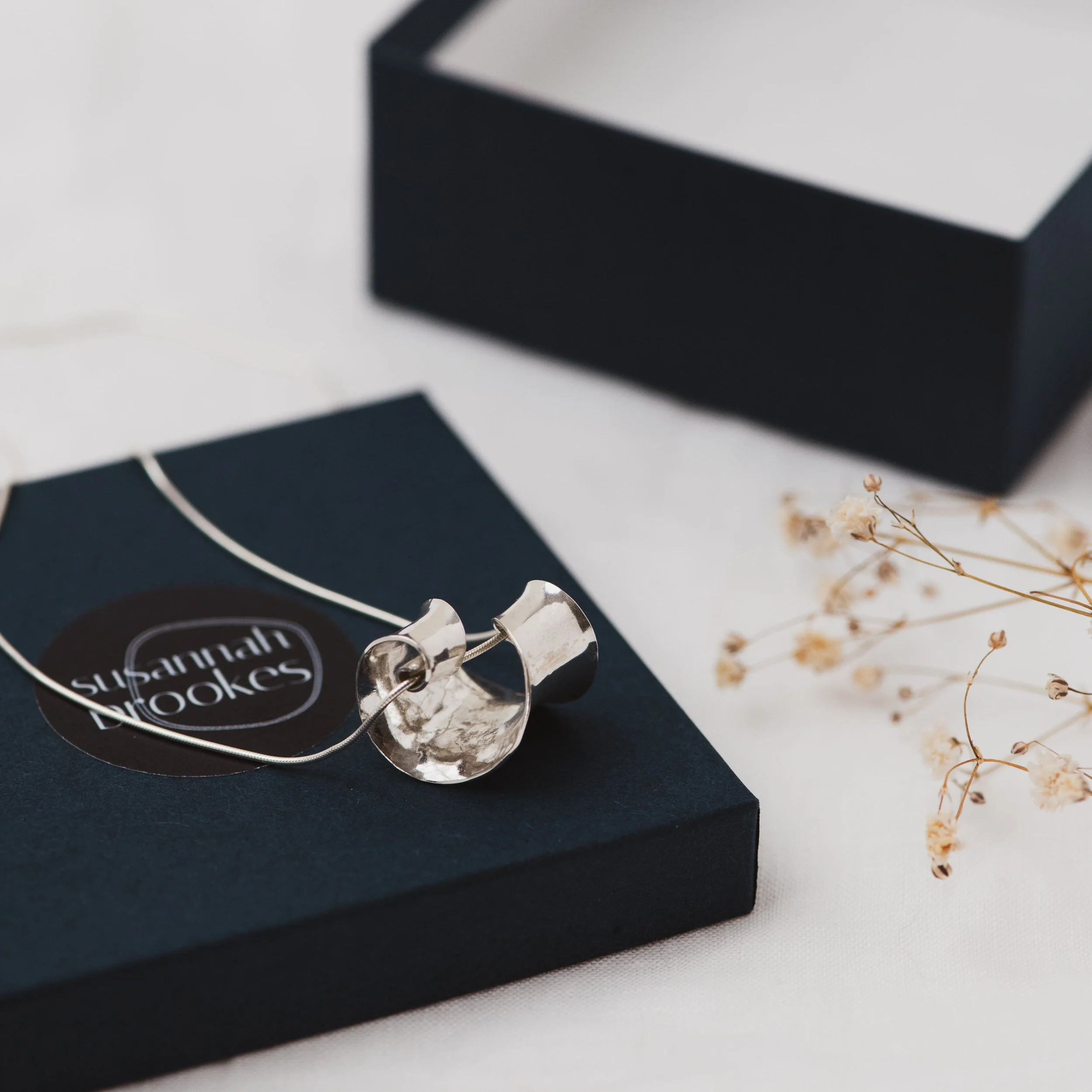 silver spiral necklace in susannah brookes box