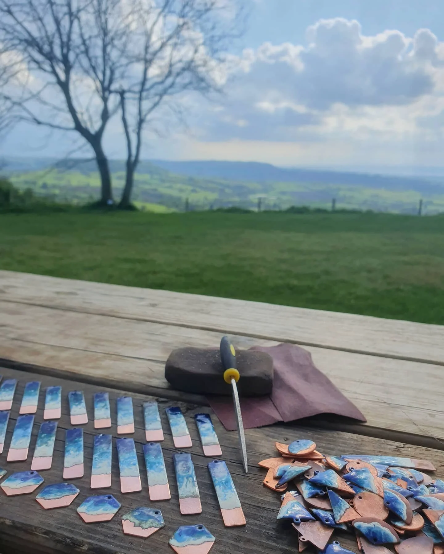 At last some sunshine! I have been busy enamelling in the studio the past few weekends. I've been putting off the polishing as its just not as satisfying as the kiln part of the process... Really does need doing though so I decided to go alfresco and