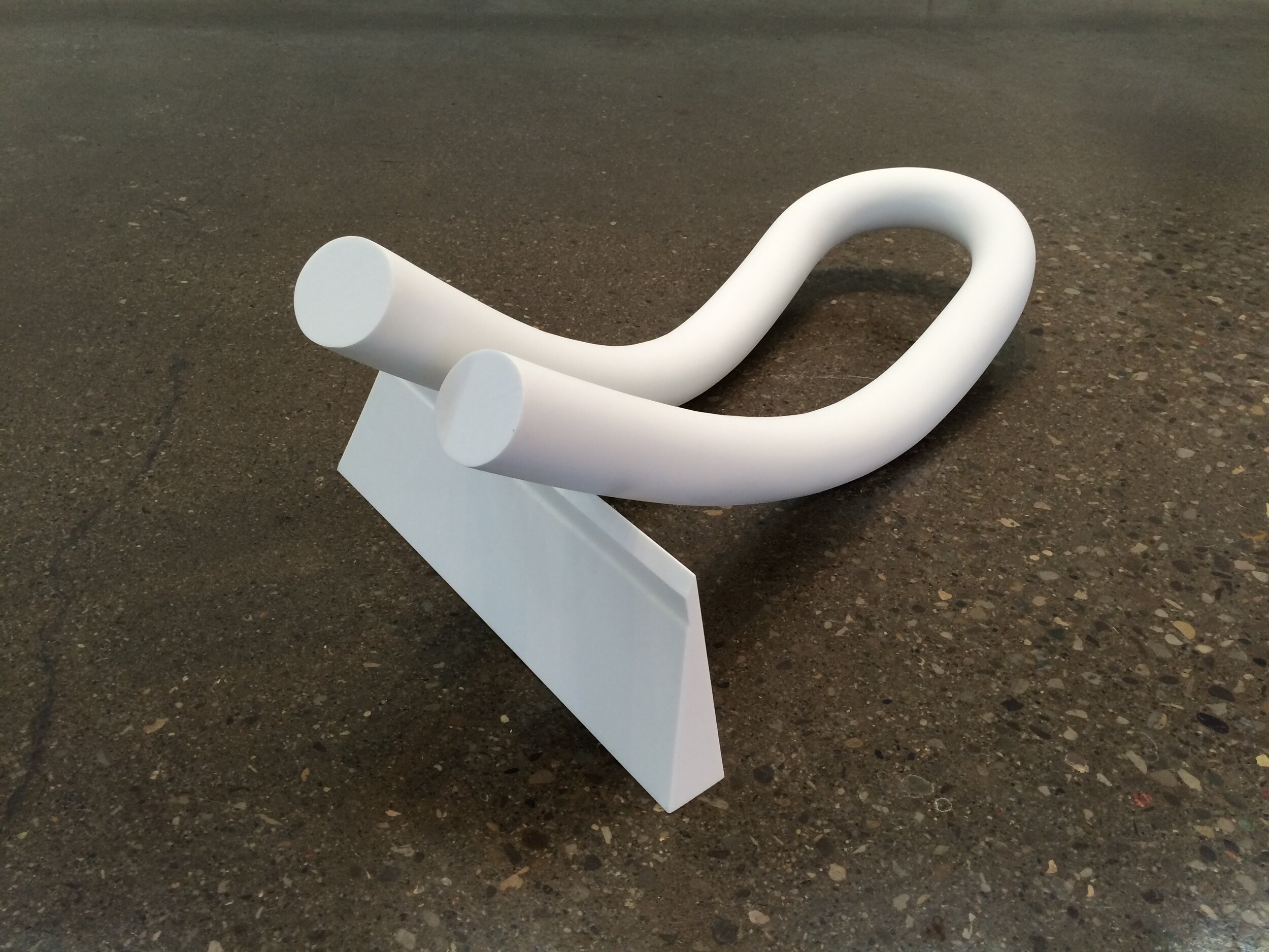 sic.
hand carved Corian. 55": 40": 16"