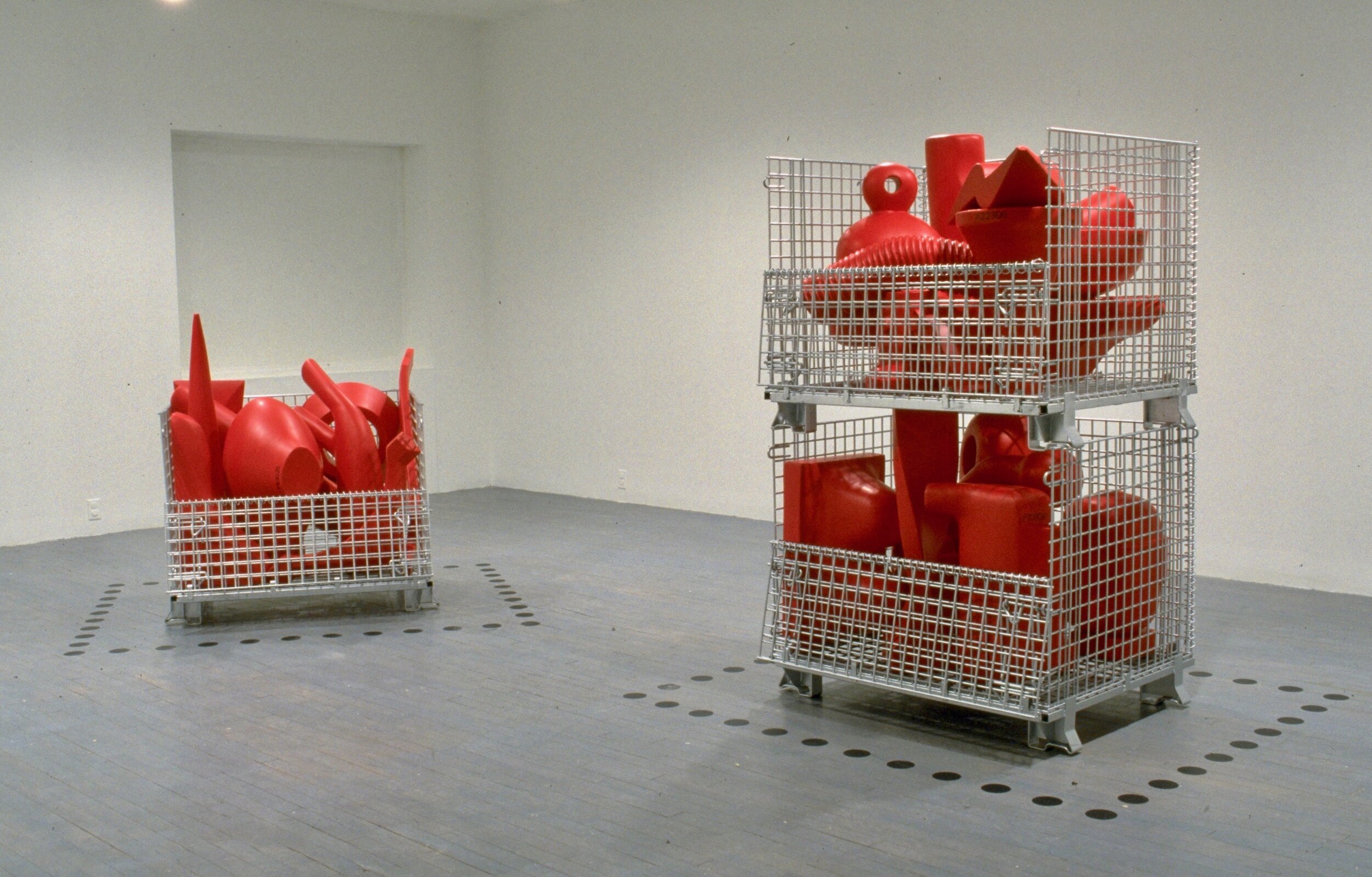 Bins. 1,2,3. 1999
28 numbered rubber coated foam carved objects, warehouse storage bins, vinyl dots