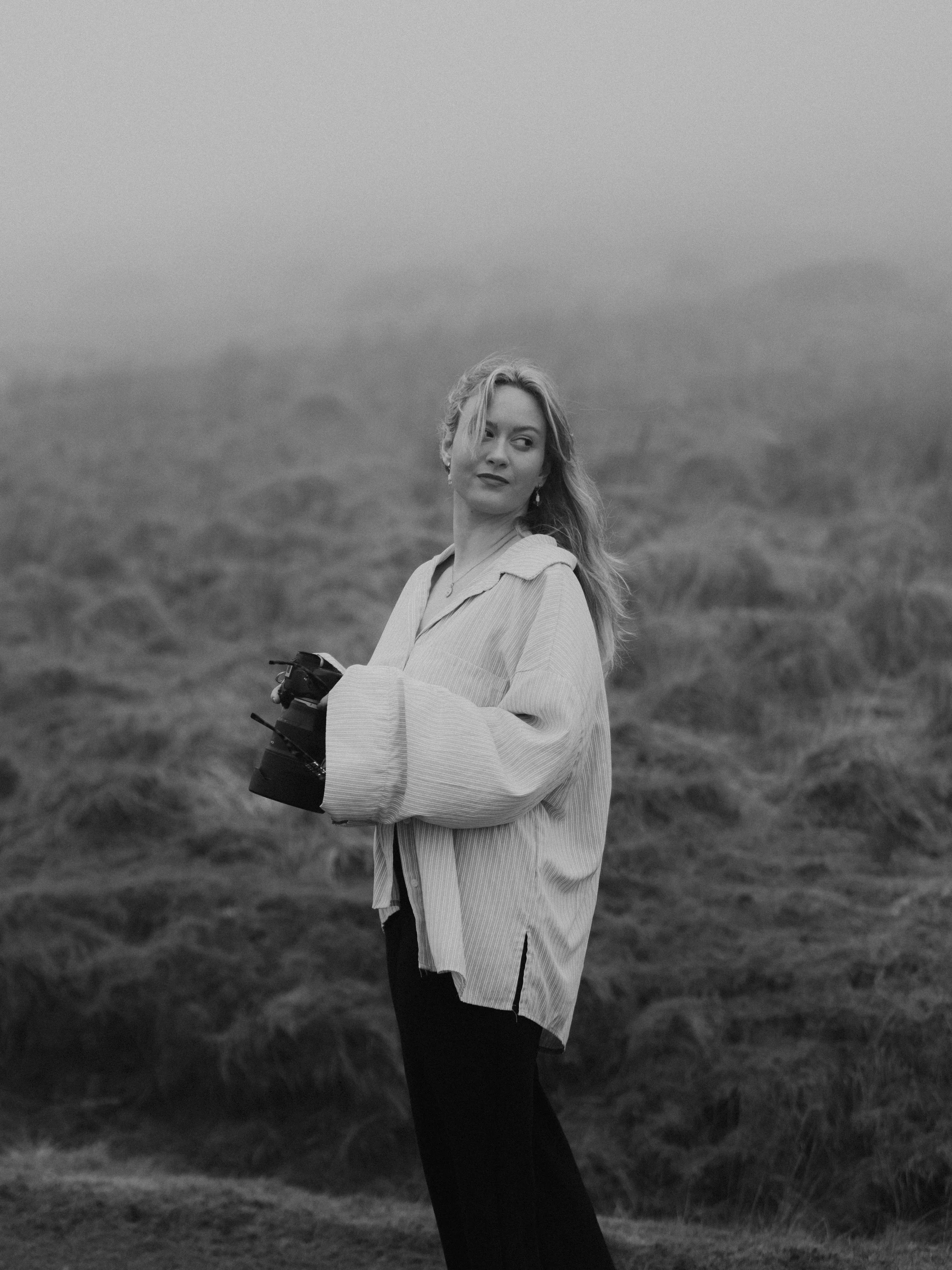 Relaxed headshot of a South Wales wedding photographer with natural makeup and soft lighting