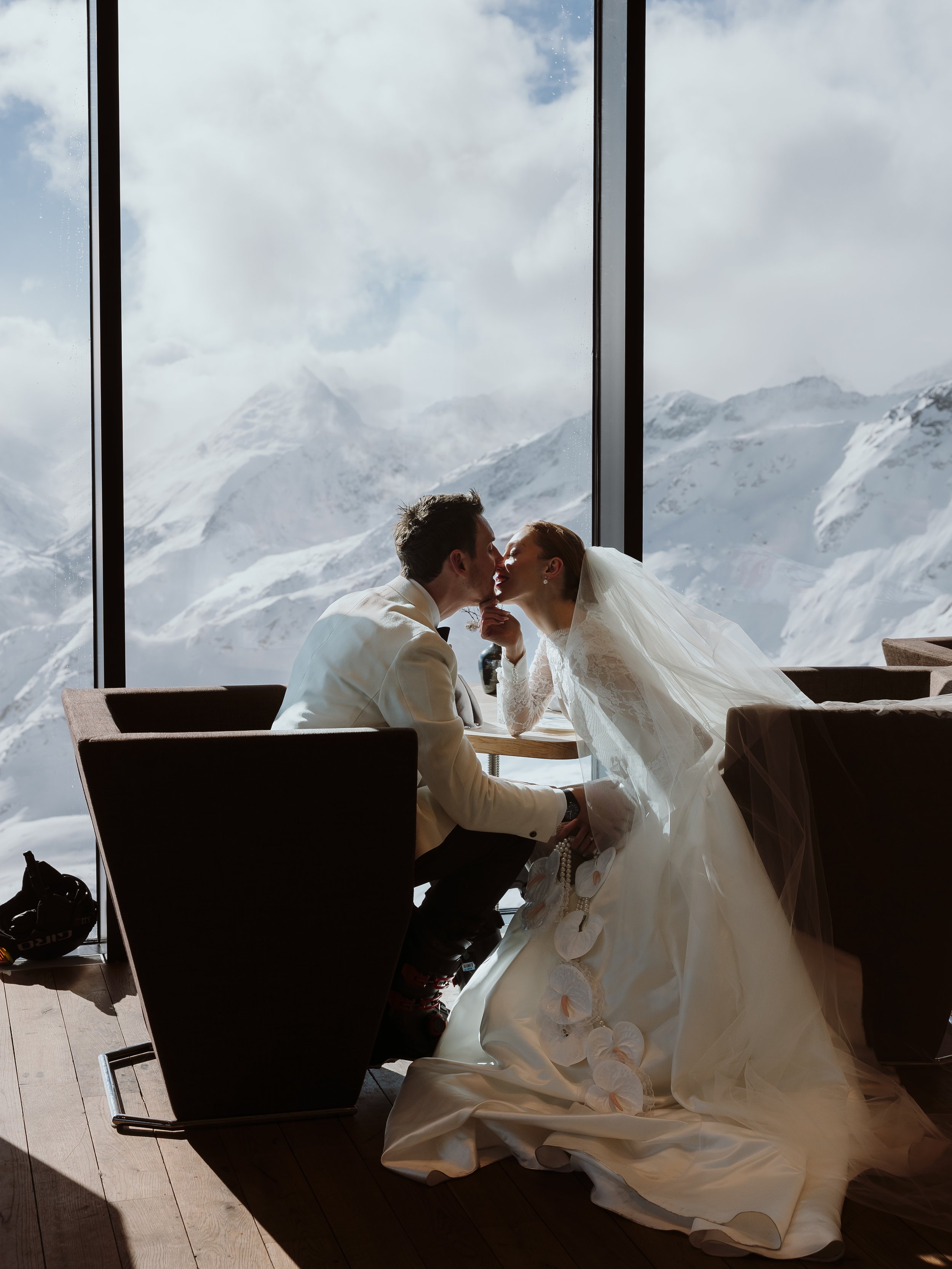 Bride and groom sharing a quiet moment indoors during a winter elopement in the Austrian Alps