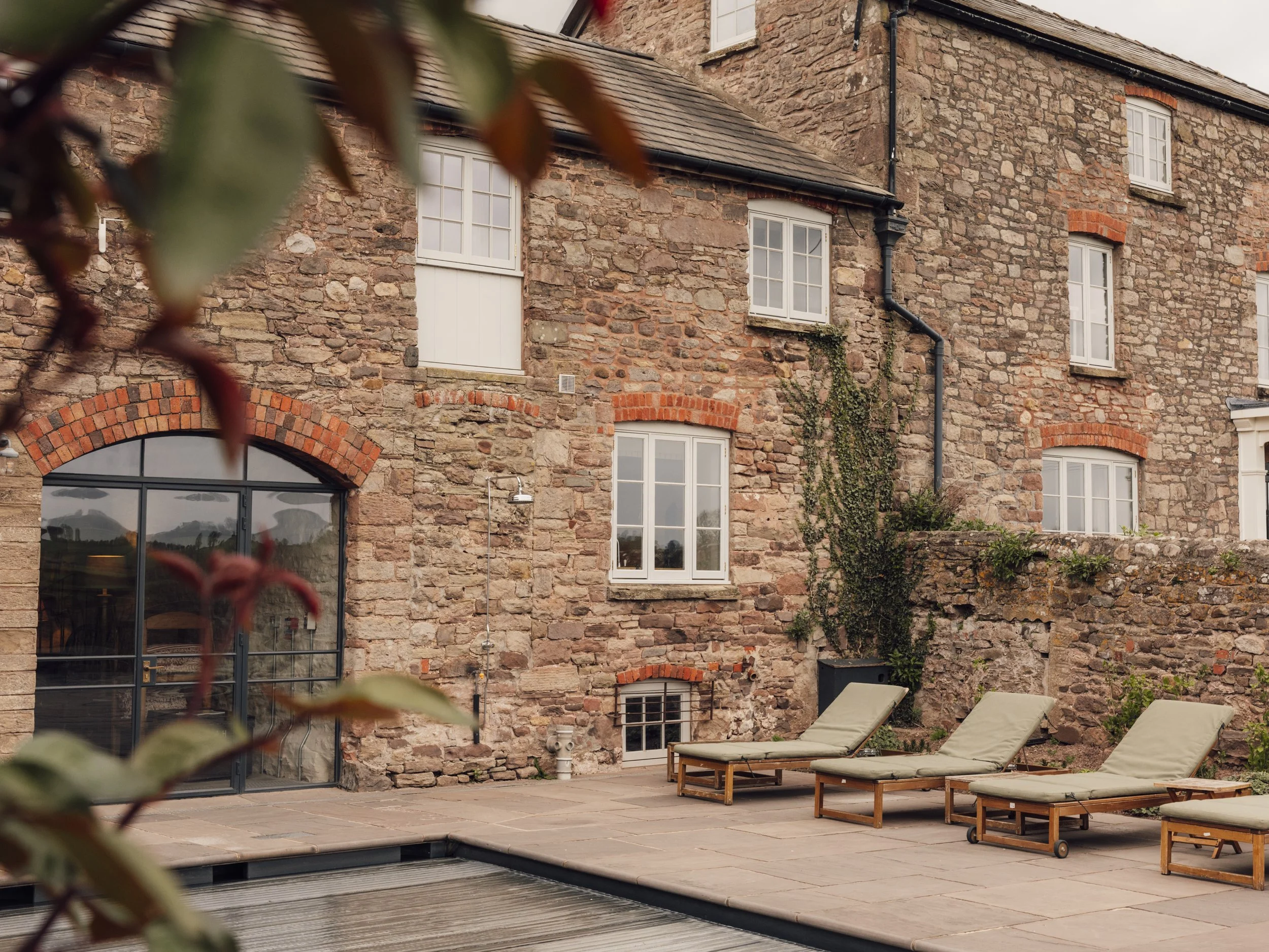 An evening image of the pool at Llantilio House, a gorgeous wedding venue in Monmouthshire.