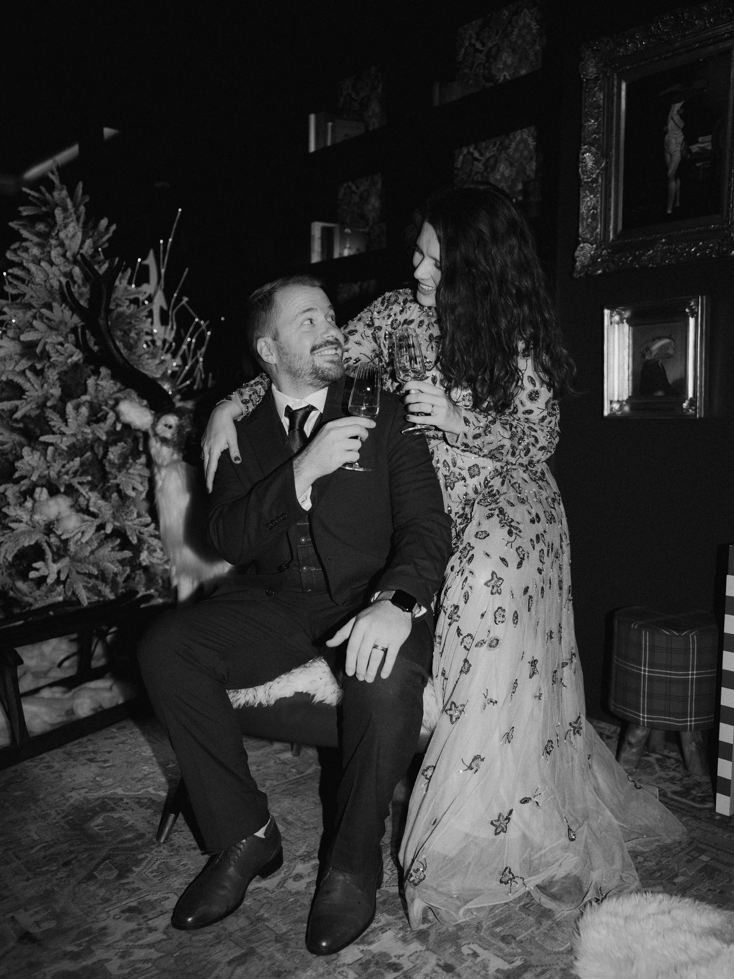 Bride and groom toasting with champagne inside The Other House hotel in South Kensington after their London elopement.