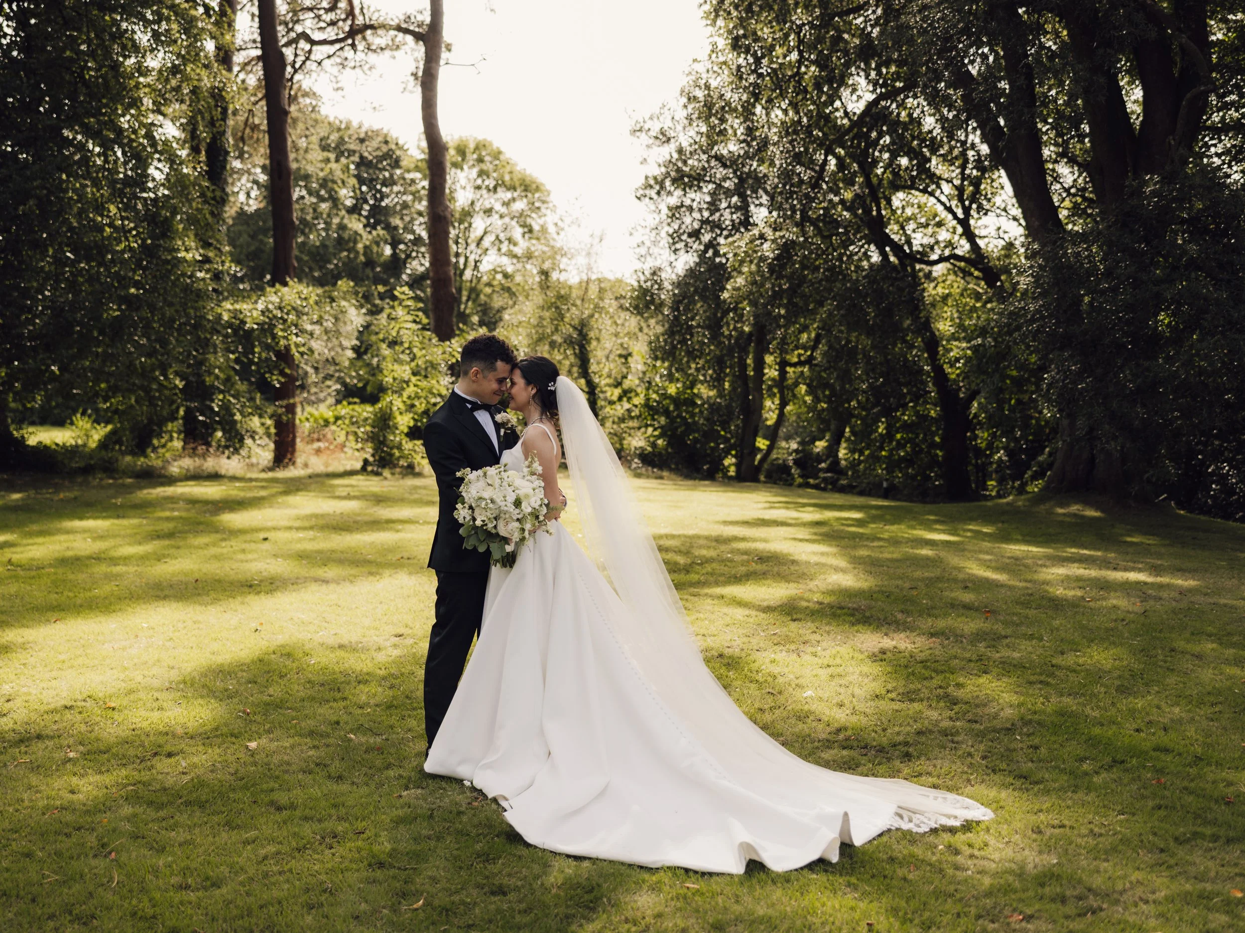 Elopement-style couple portraits photographed in natural light with a relaxed, outdoor feel
