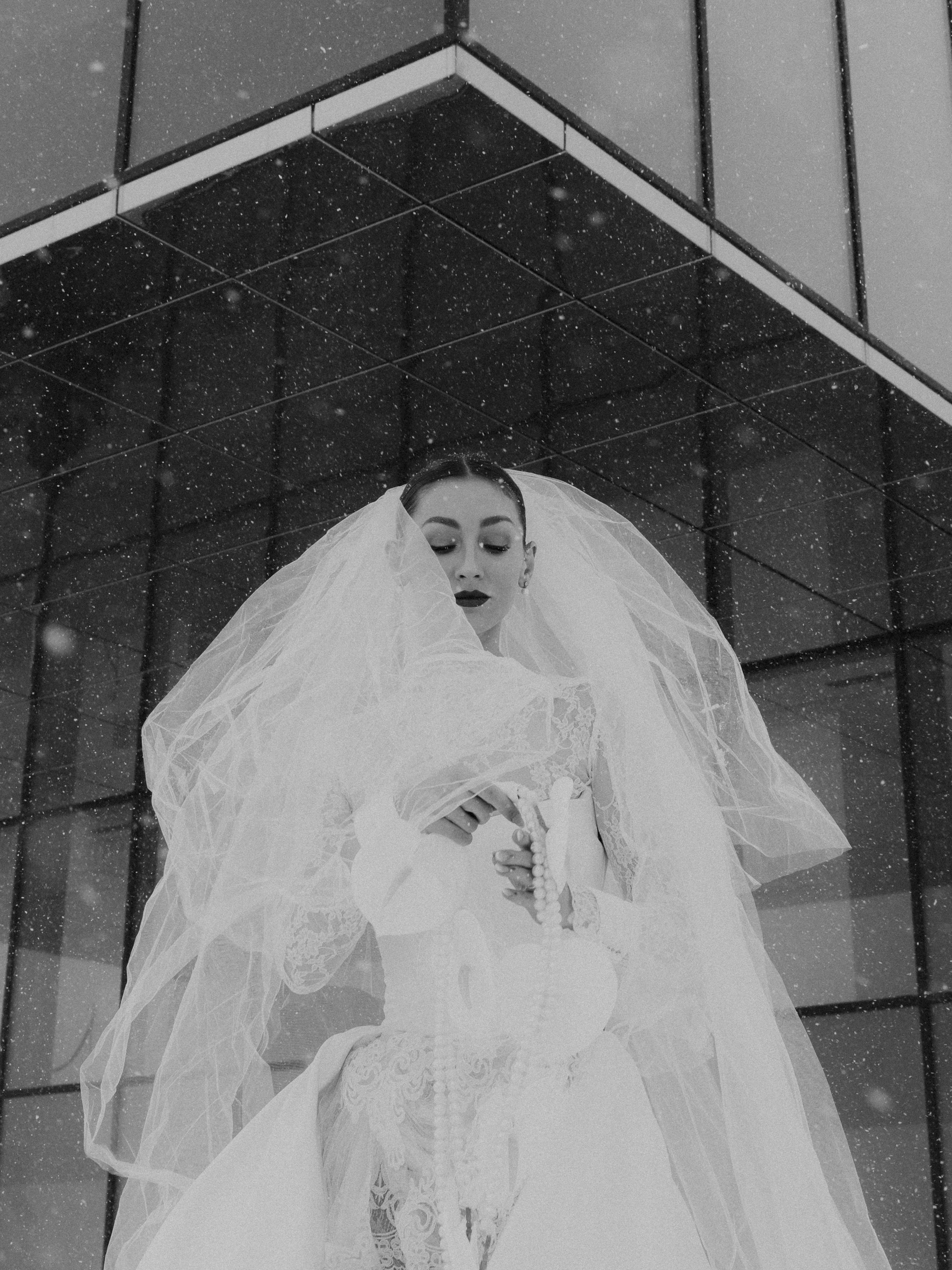 Bride wearing an editorial bridal look during a winter destination elopement in Austria