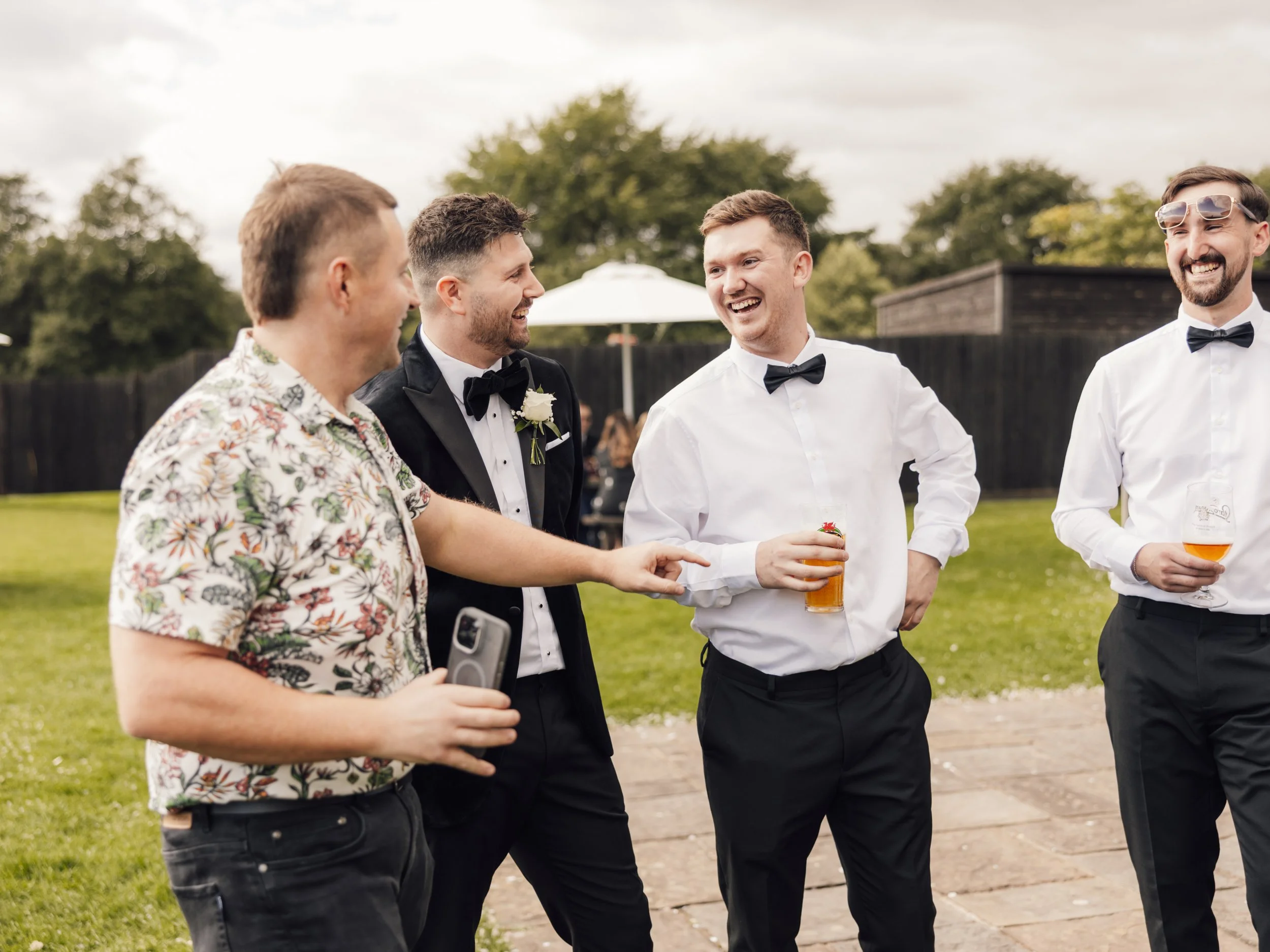 magician Adam Reeves making guests laugh at a llanerch vineyard summer wedding