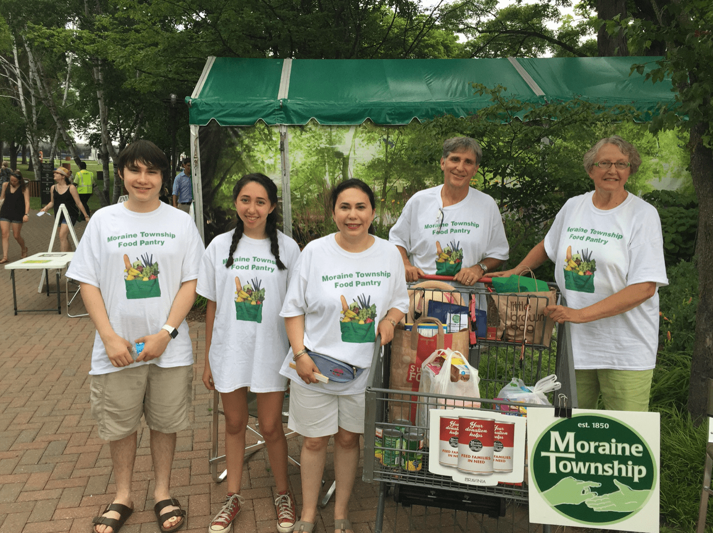 Yumi and family volunteering, Moraine Township Food Panrty-min.png