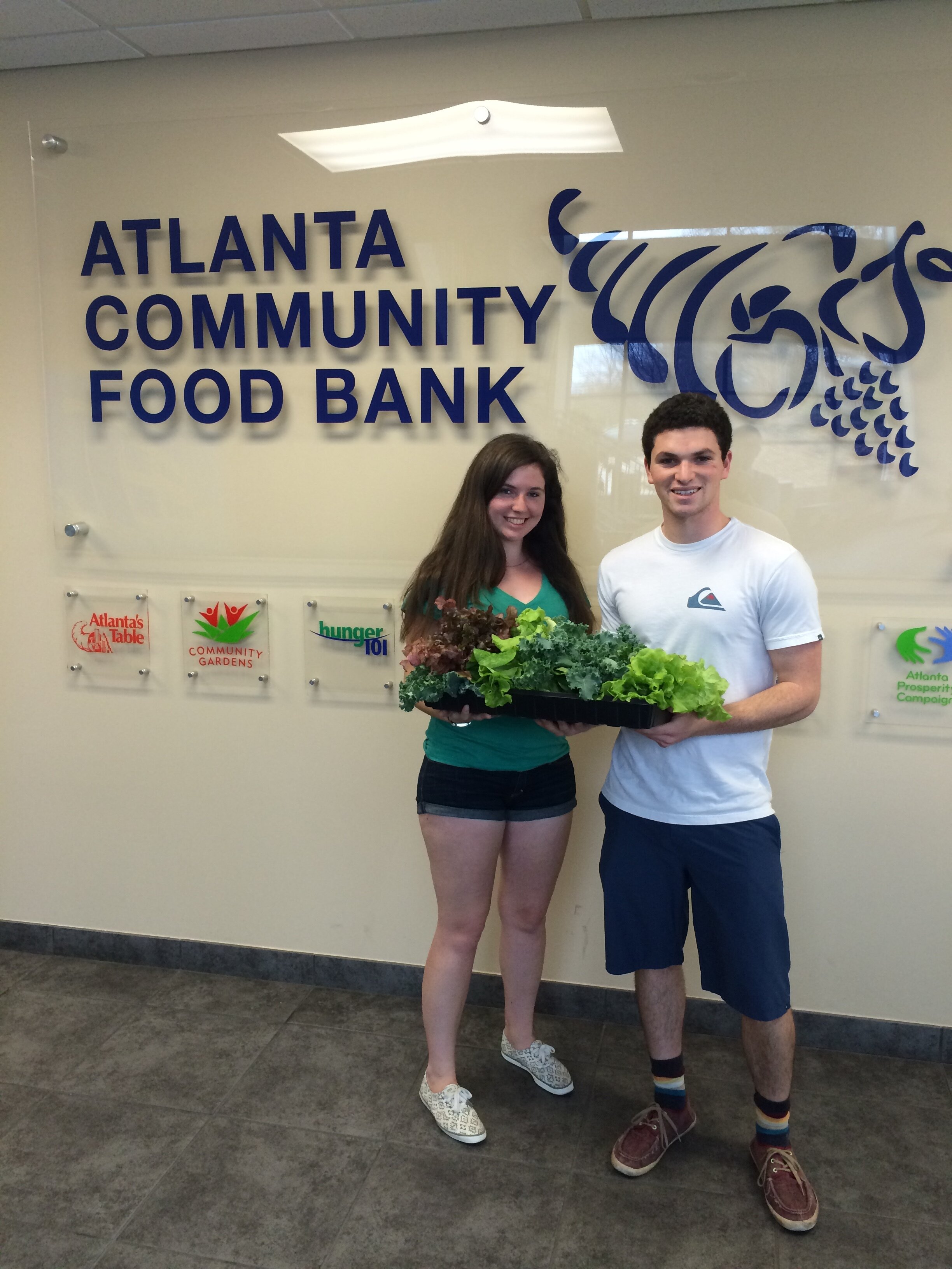 Jamie &amp; I donating produce to ACFB