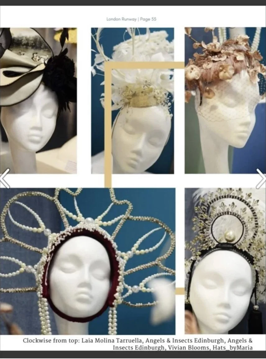 Display of ornate headpieces and hats on mannequin heads at a fashion exhibition, including floral and pearl designs.