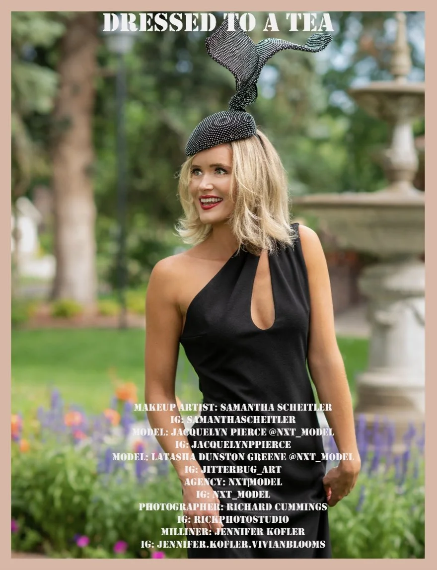 A woman wearing a black dress with a tear-shaped neckline, standing outdoors in a garden. She has blonde hair and is wearing a fascinator hat with a large, decorative bow on top. The text on the image reads "Dressed to a Tea" and lists contributors including makeup artist, models, photographer, and milliner.