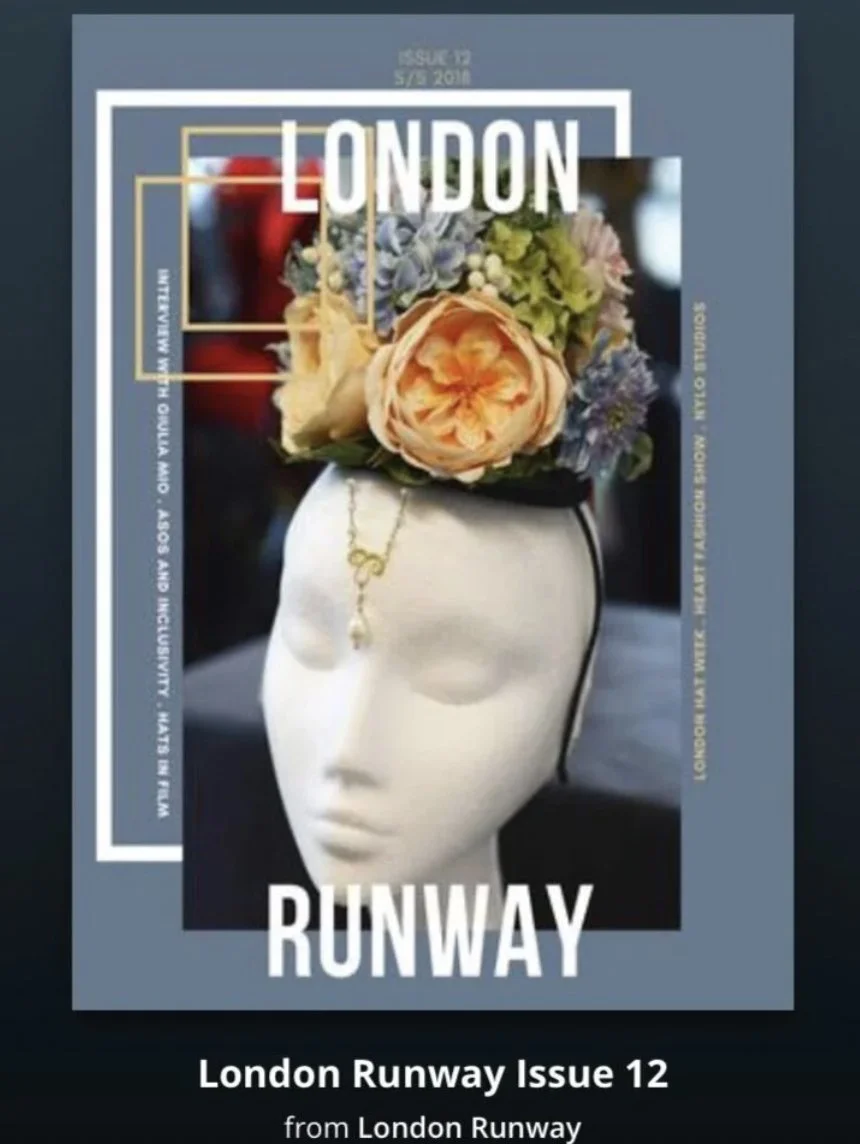 Magazine cover for London Runway Issue 12, featuring a mannequin head with a floral arrangement on top and a necklace hanging from its forehead.
