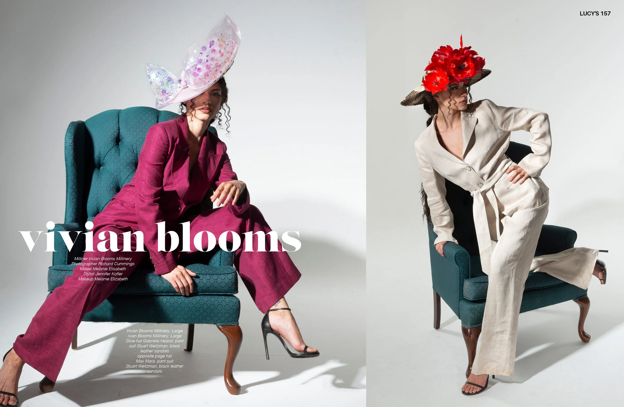Two women wearing large, artistic hats pose on chairs against a white background, for a Vivian Blooms magazine photoshoot.