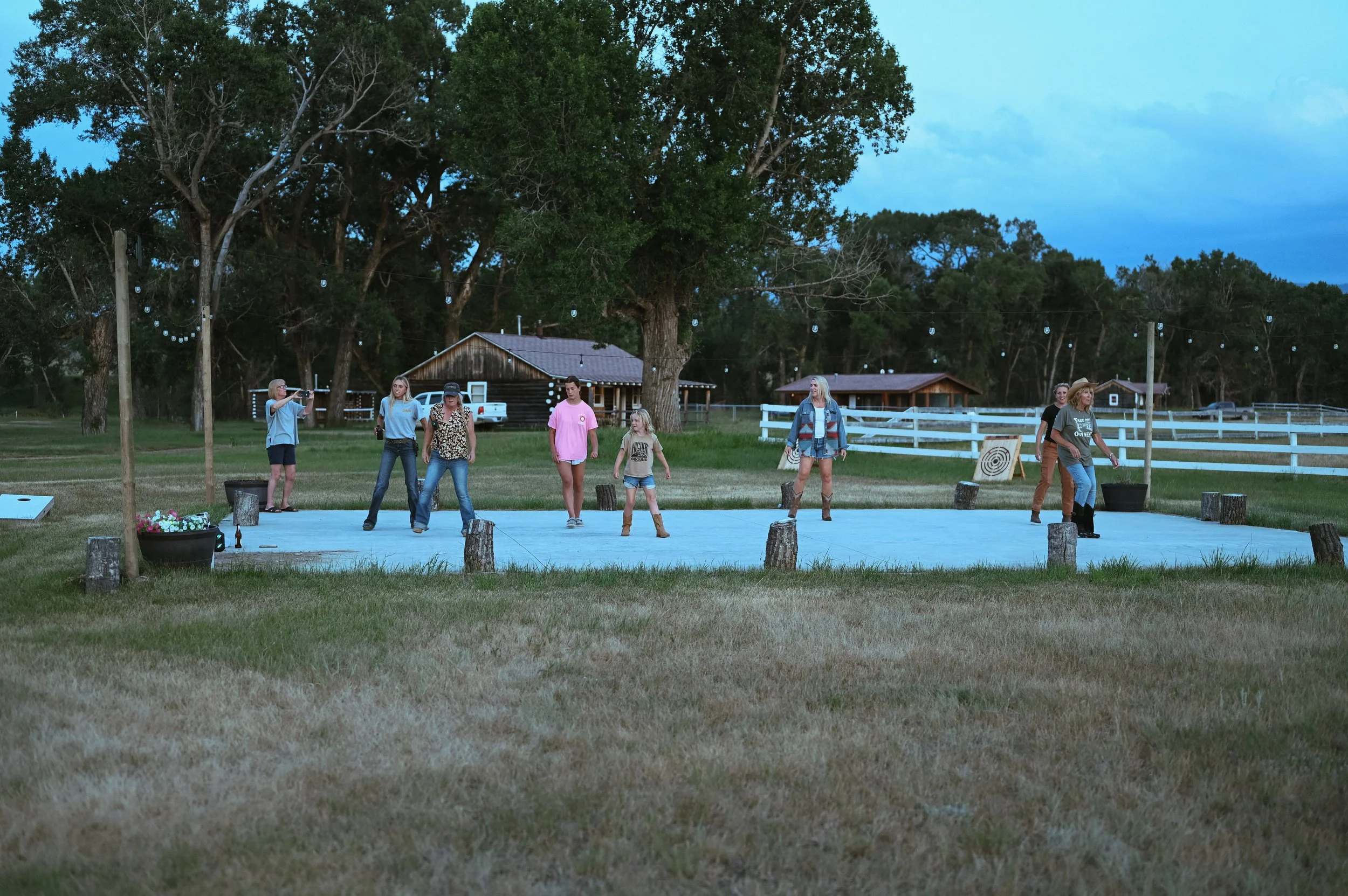 A group of Circle Bar dude ranch guests line dancing.