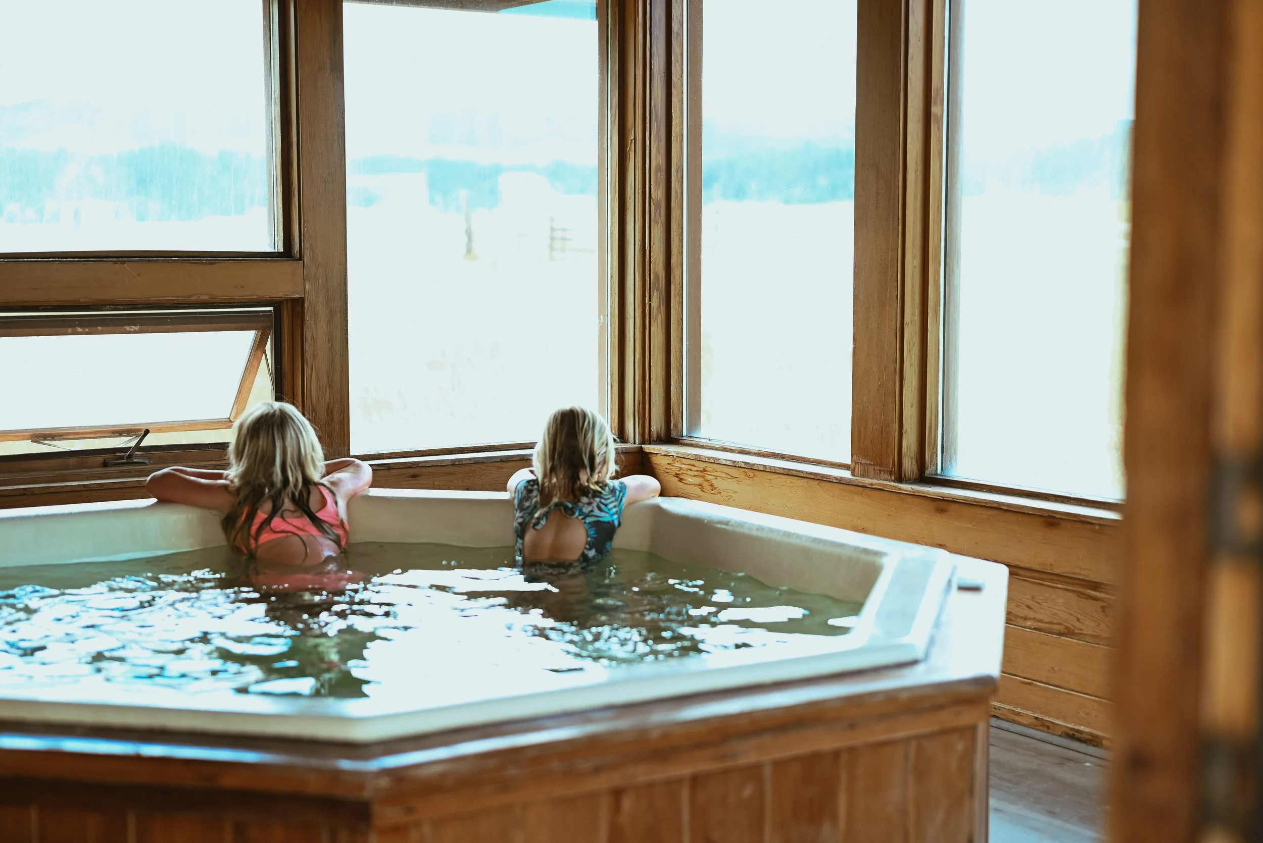 Dude ranch guests in the hot tub at Circle Bar guest ranch.