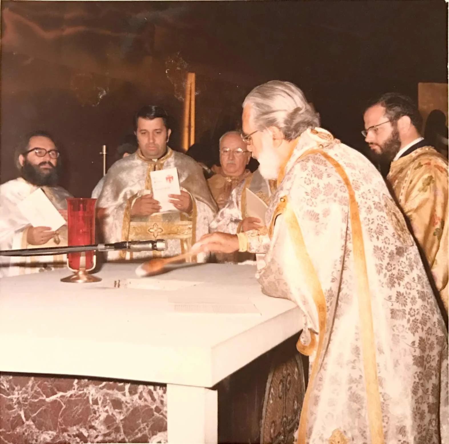 Preparing and blessing the altar.