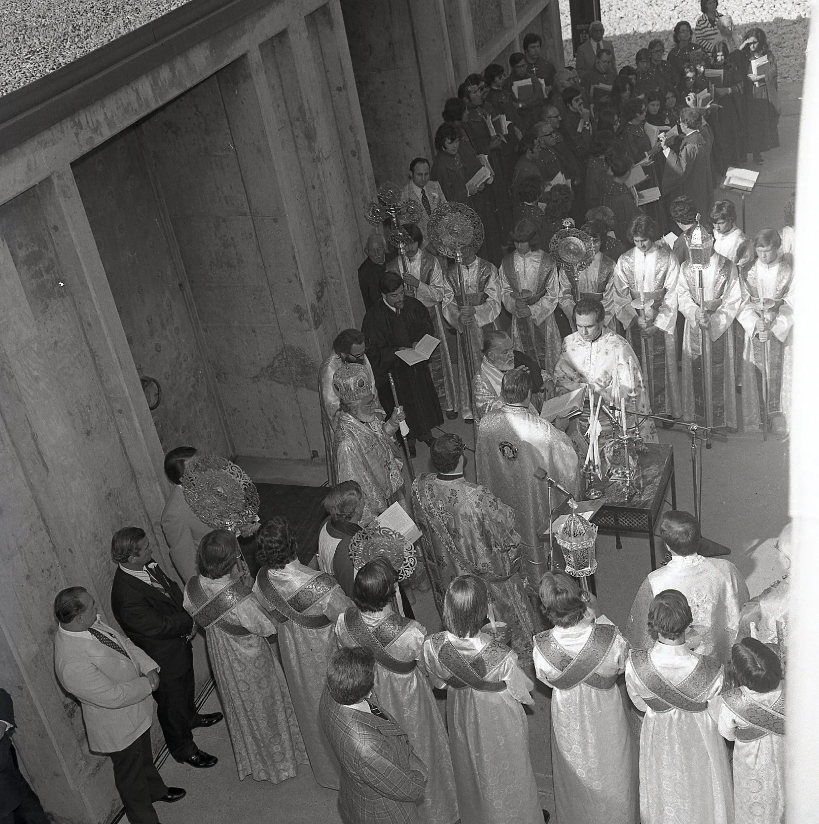 Gathering outside the doors of the church.