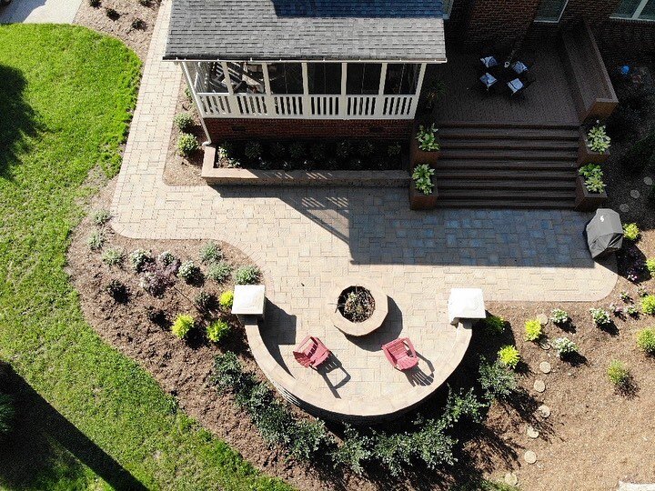 We transformed this space with a composite deck coming down onto hardscaping to allow the client to have the best of both worlds for all entertainment and family needs. Really turned out to be a great use of space on this sloped yard. Swipe to see ou