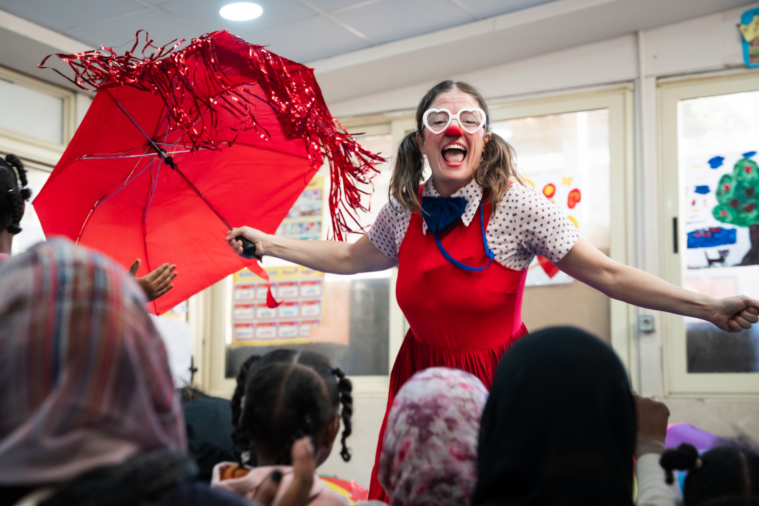 John McGrane / UNHCR. Clowns Without Borders. 2025