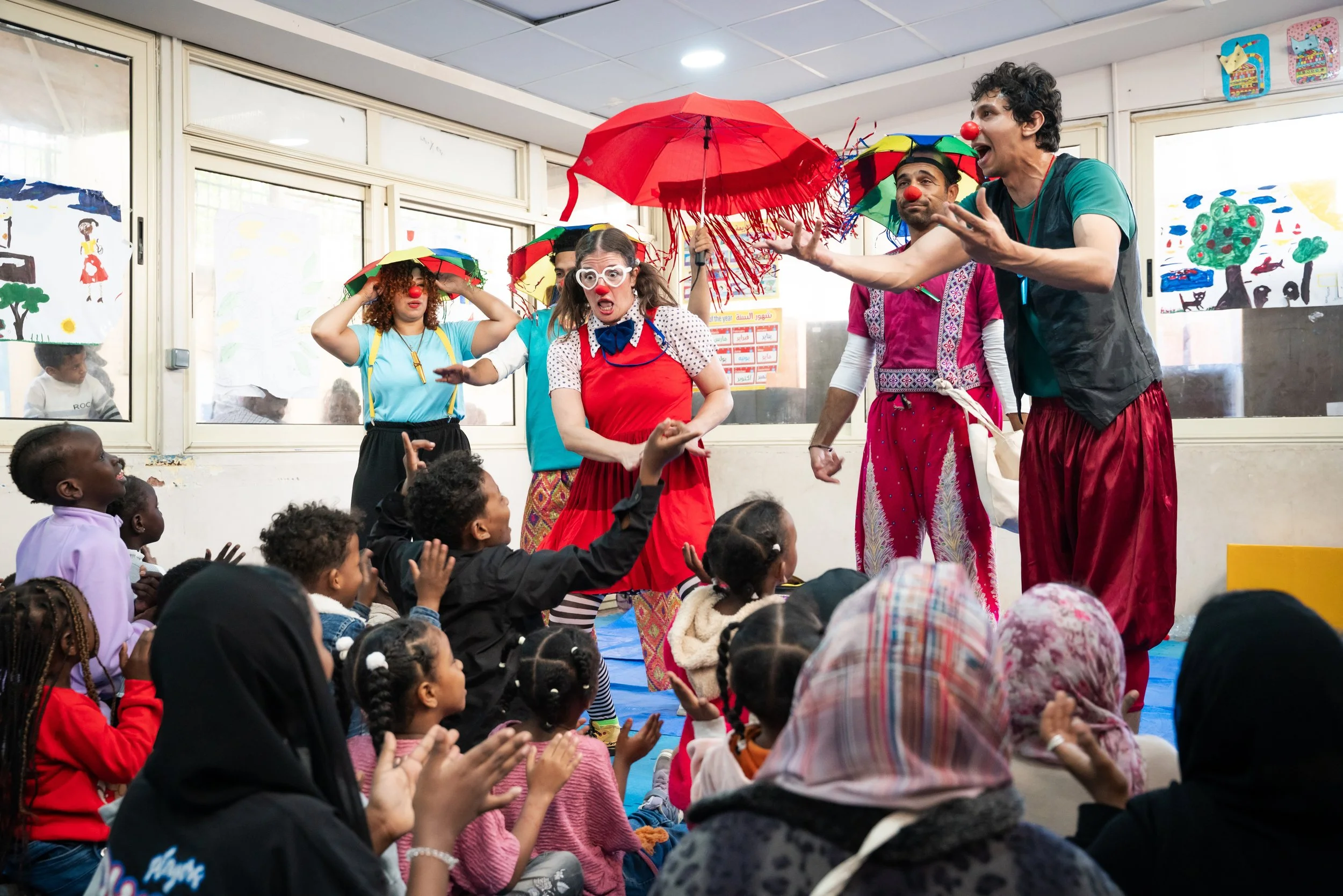 John McGrane / UNHCR. Clowns Without Borders. 2025