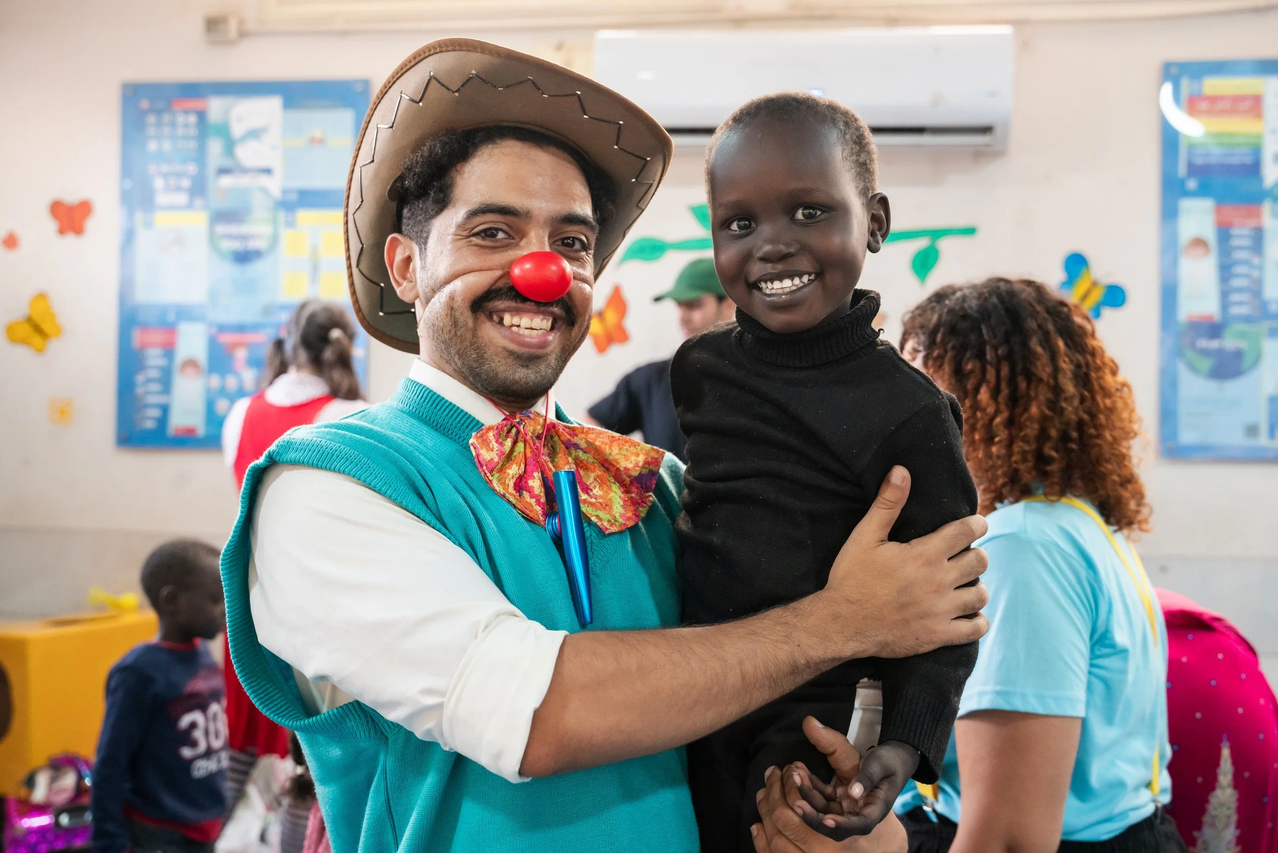 John McGrane / UNHCR. Clowns Without Borders. 2025